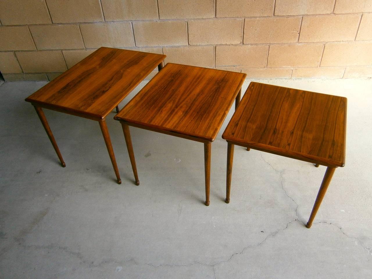 A trio of rosewood stacking tables made in Norway by Brode Blindheim in the 1960s. The tables are a combination of solid rosewood and rosewood veneer and retain the luminance the rosewood develops over time. The dimensions in the listing are for the