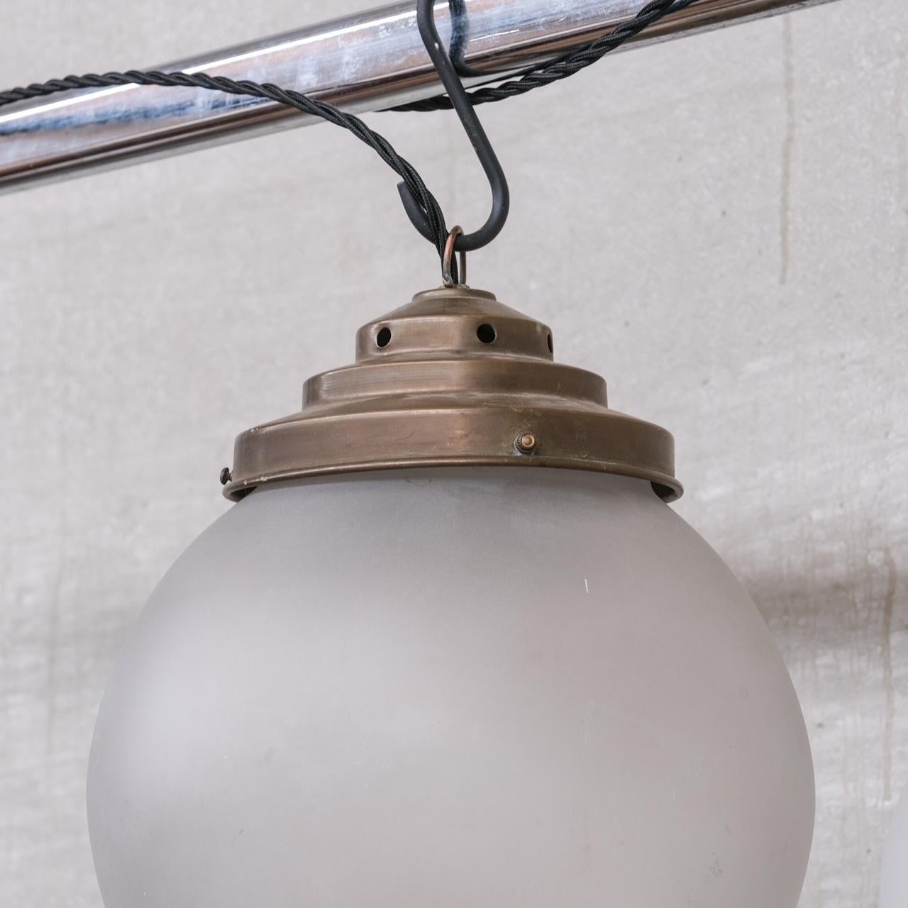 20th Century Trio of Opaque Glass and Brass Pendant Lights For Sale