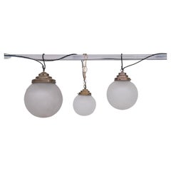 Vintage Trio of Opaque Glass and Brass Pendant Lights