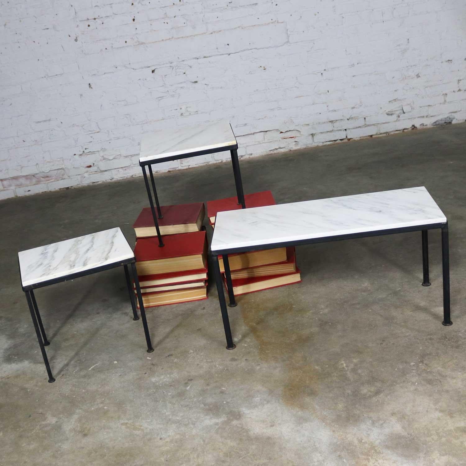 If you are looking for little tables for a small sitting area…….look no further. Whether it is indoors or out! This trio is comprised of a pair of small side tables and a diminutive rectangular coffee table. Their frame is black painted iron. The