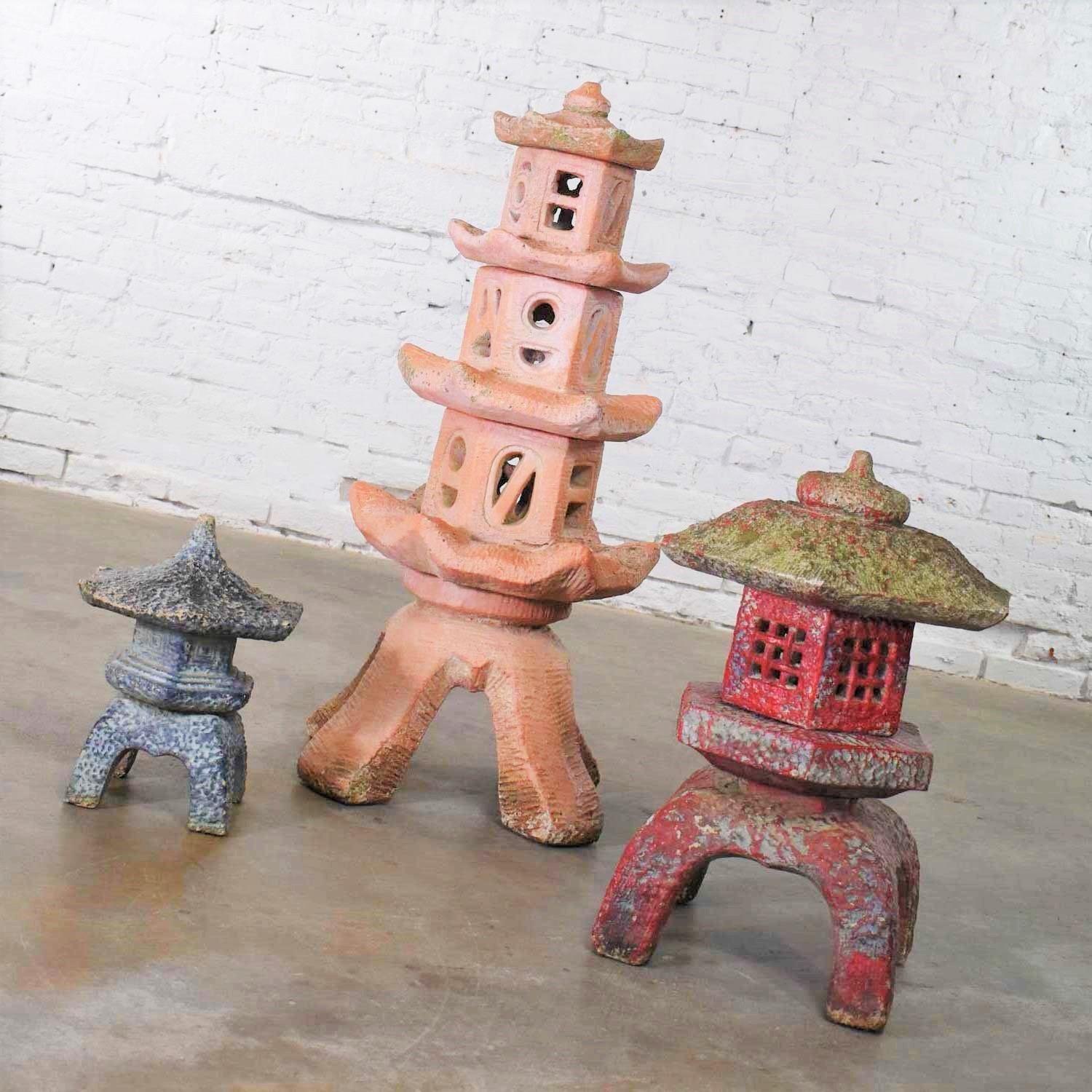 Outstanding trio of vintage concrete Japanese pagoda garden ornaments in three different heights. They are in awesome condition with lots of natural age patina including lichen, chips, and dings. No major flaws just a gorgeous patina. Please see