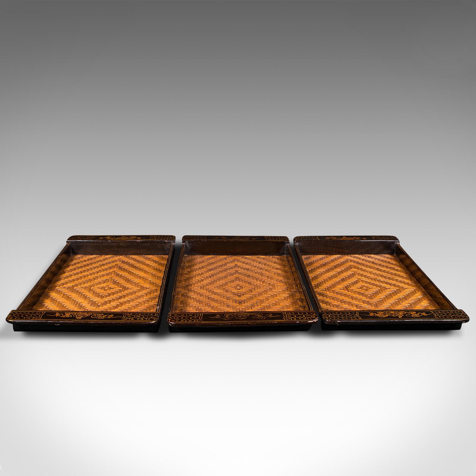 This is a trio of vintage dinner trays. A Japanese, lacquered serving platter with woven bamboo centres, dating to the late Art Deco period, circa 1940.

Vibrant decor across three useful serving trays
Displaying a desirable aged patina and in