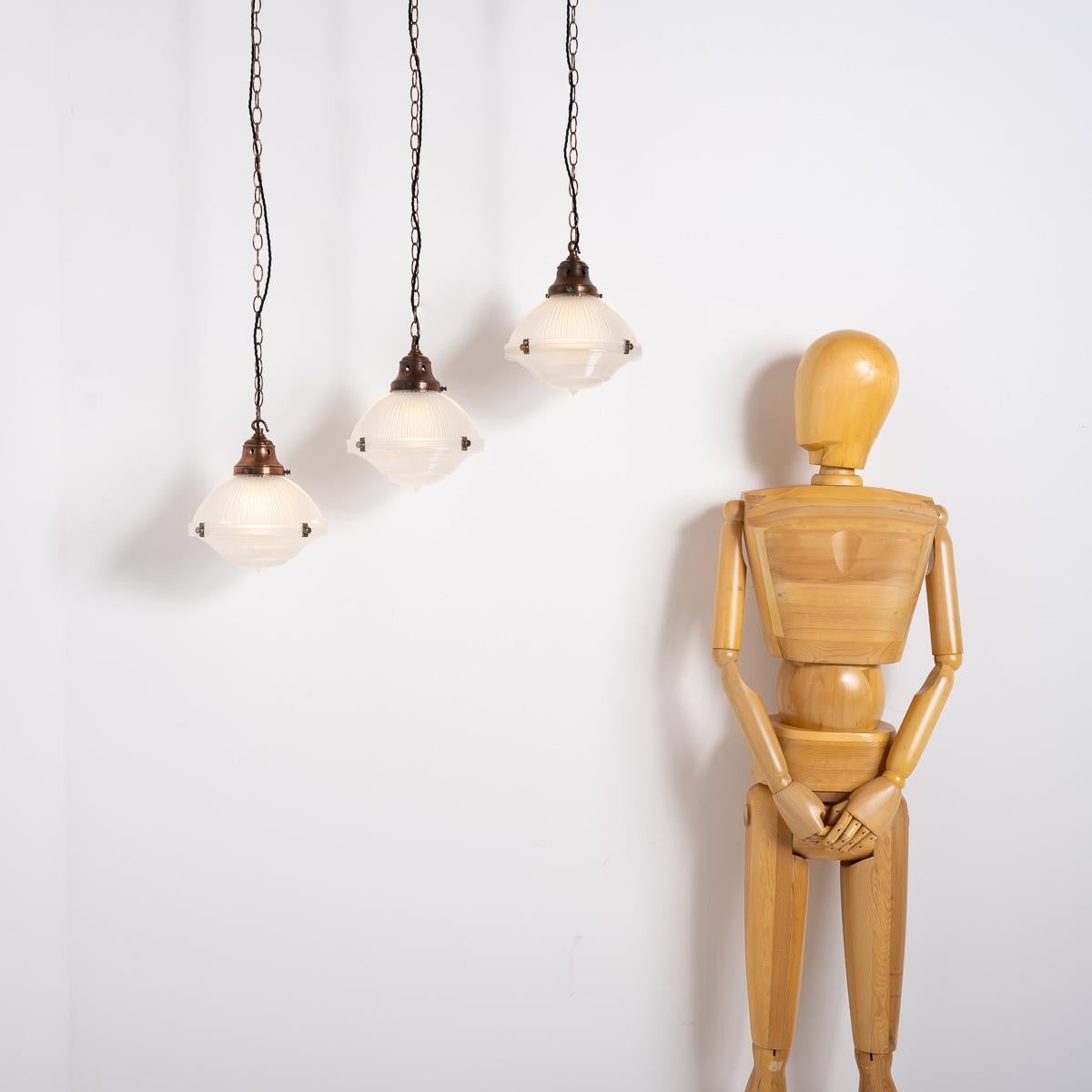 Mid-20th Century Trio of Vintage Holophane Three Part Pendant Lights with Coppered Fittings For Sale