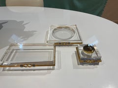 Trio of vintage lucite and brass, chrome banding desk accessories