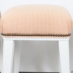 Trio of White Bar Stools with Peach Striped Upholstered Seats