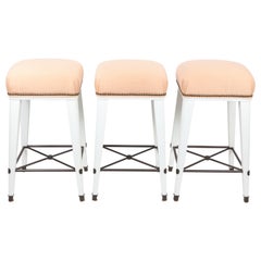 Trio of White Bar Stools with Peach Striped Upholstered Seats