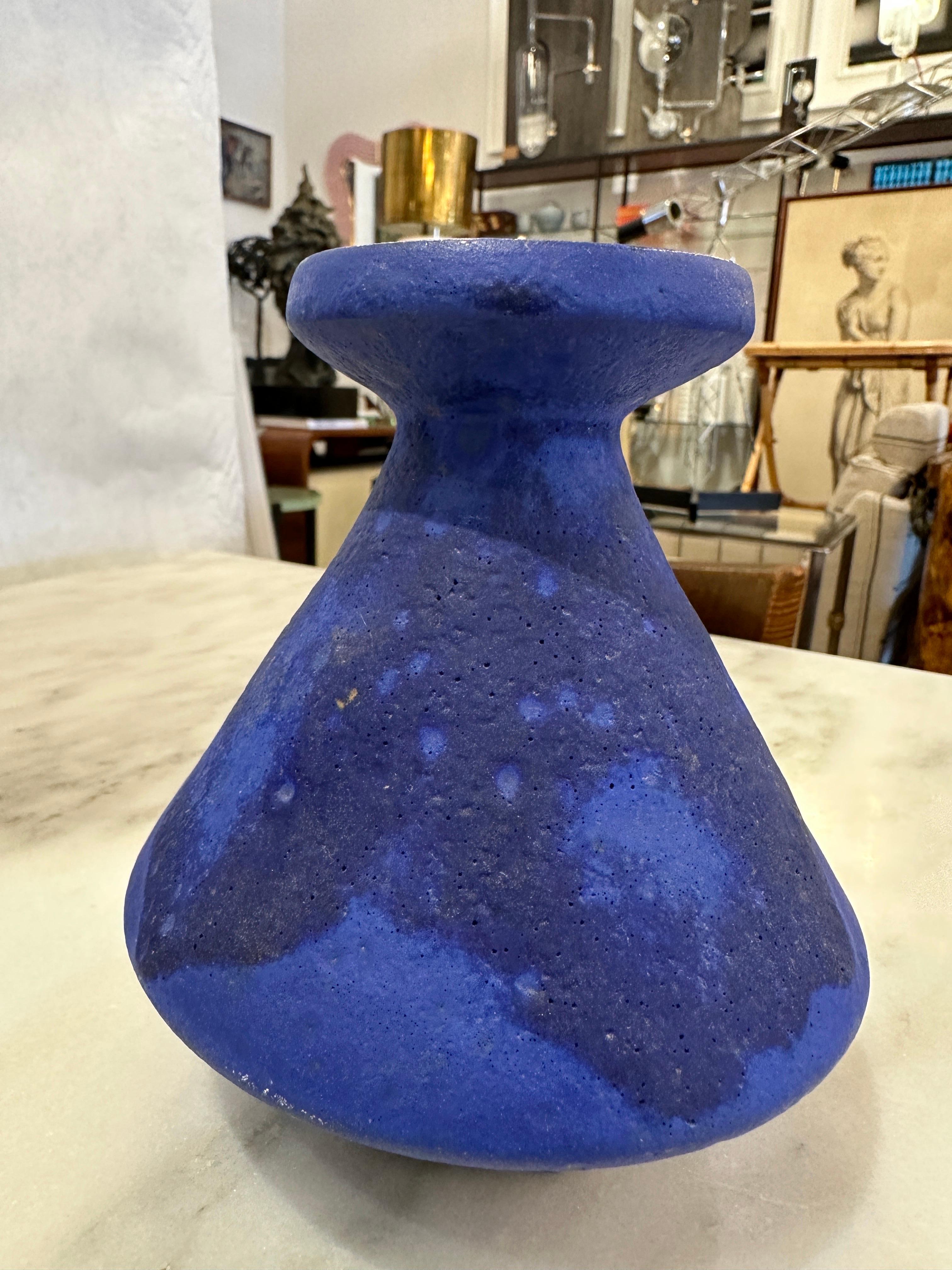 This lovely grouping of vibrant blue toned West German pottery comprises of a small vase with handle, a lidded vessel and a standard flared vase.  All three are 1960's pre-unification of Germany.  THIS ITEM IS LOCATED AND WILL SHIP FROM OUR MIAMI,