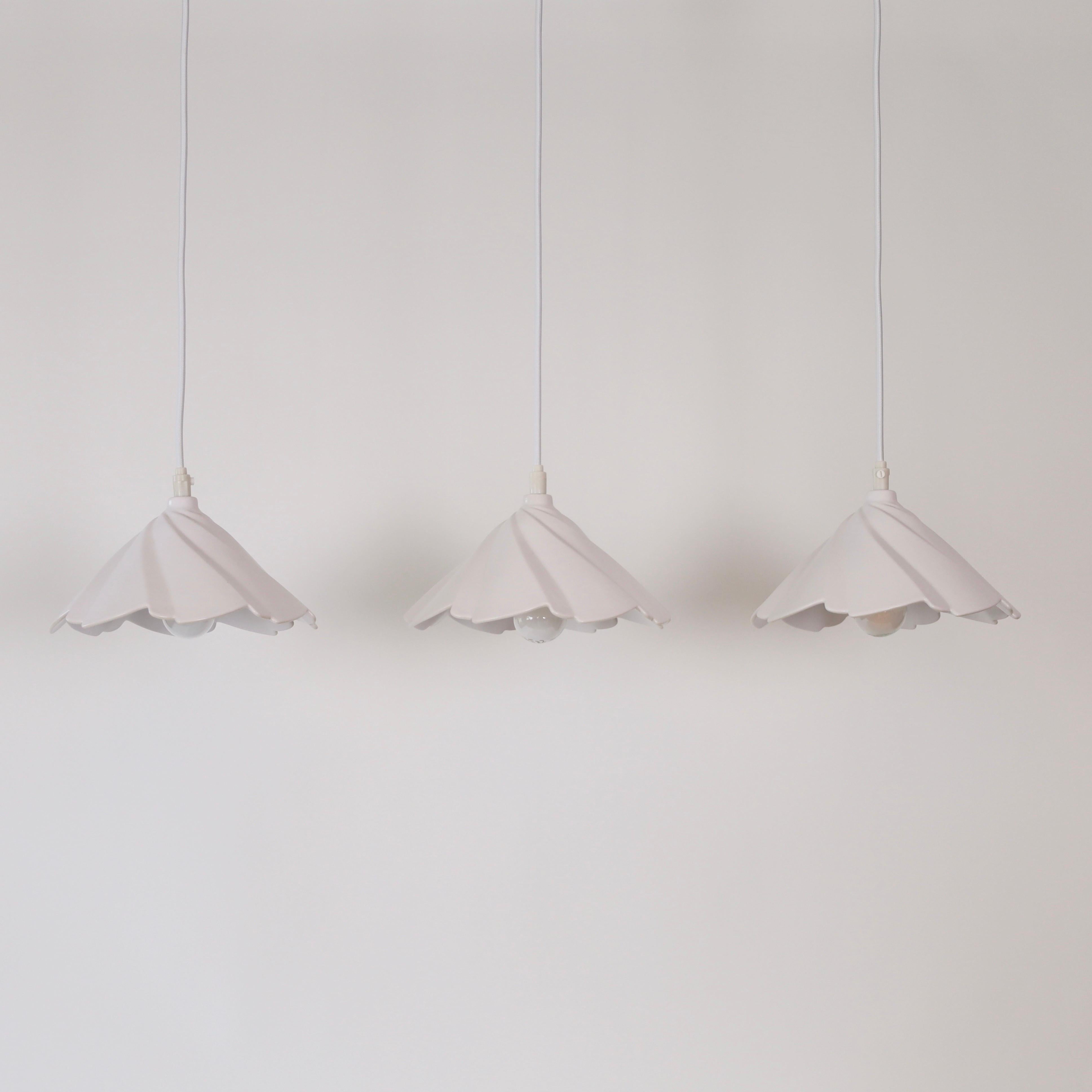 Set of three white Scalloped Porcelain Pendant lights by Soeholm Stentoej. A fine trio for a beautiful place. 

* A set of three (3) white scalloped porcelain pendant lights 
* Producer: Søholm Stentøj, Denmark
* Design year: 1970s
* Condition: