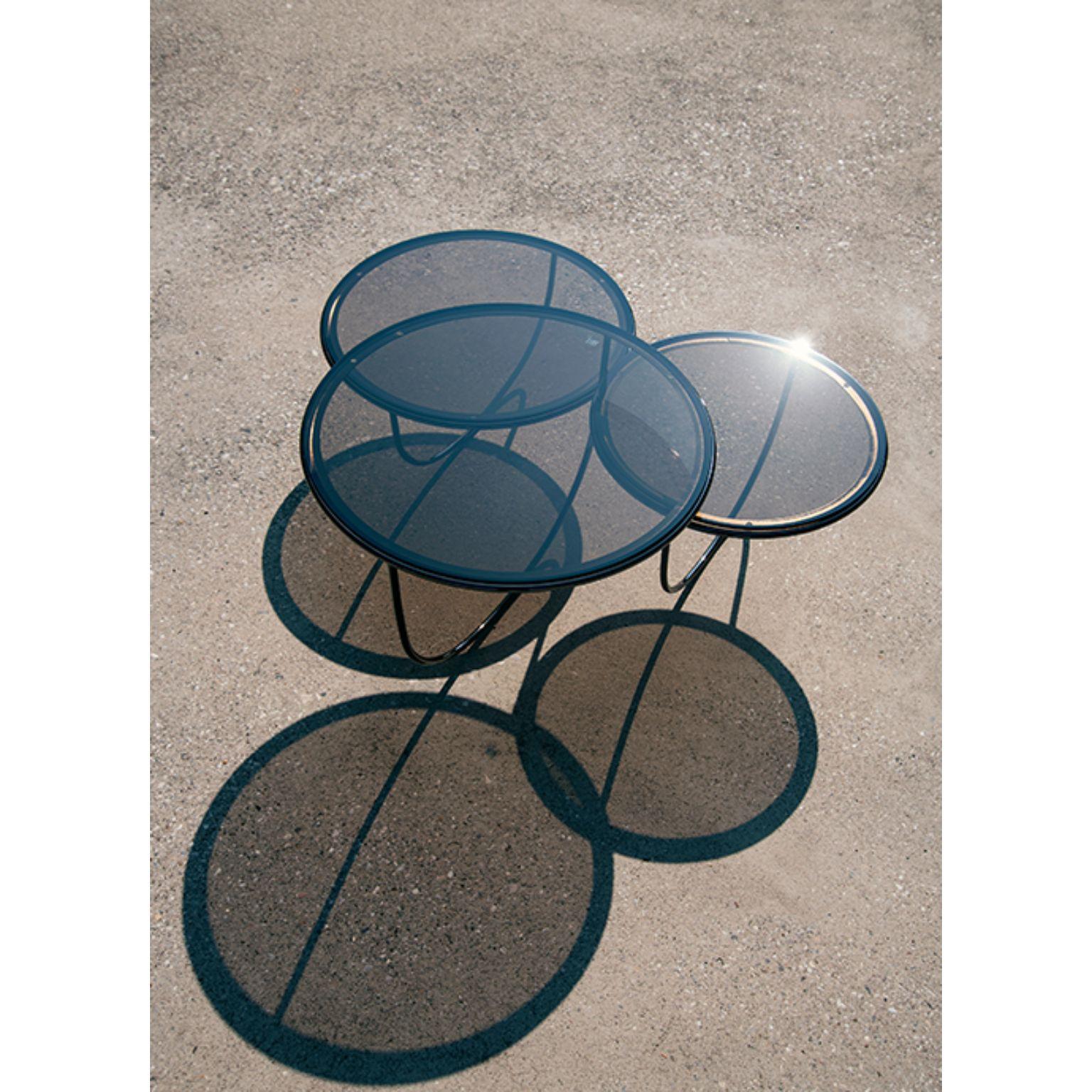 Trio side table by Nendo
Materials: Top: Noce Canaletto solid wood, Glass or Metal
 Structure: Black chrome metal, Black/Light grey NCS 2002 Y50R/Coral NCS 2570 Y70R /Dark 
 Green NCS 8010 B70G powder-coated metal
Dimensions: W 84.7 x D 76.3 x H