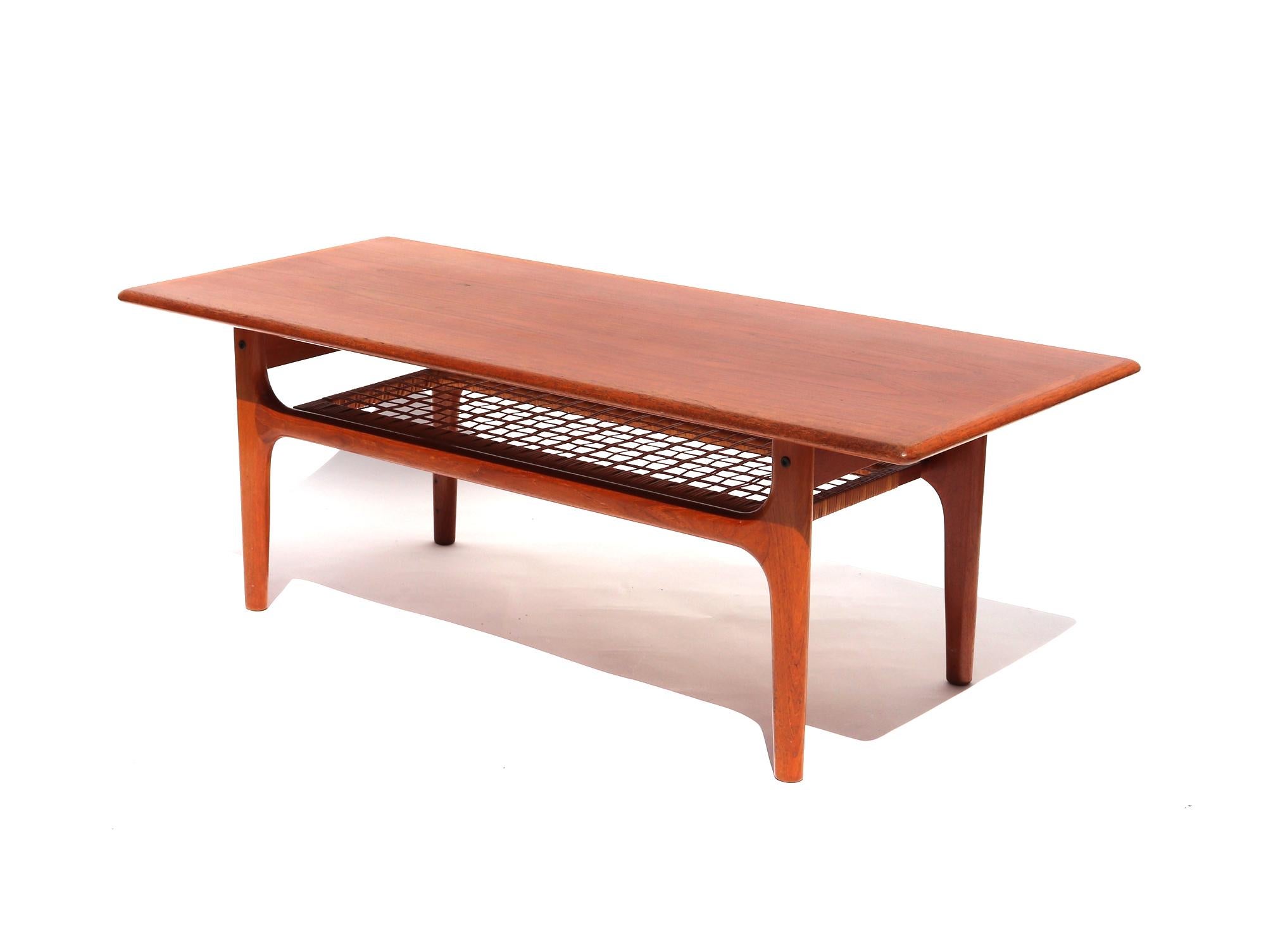 Trioh Danish Modern coffee table,
1960s

Trioh Danish modern coffee table of rectangular form with a lower woven cane shelf. 

Classic, clean styling in this Danish modern coffee table – woven cane shelf adds additional interesting textural