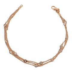Bracciale a tre file di diamanti per stazione in oro rosa a 14 carati