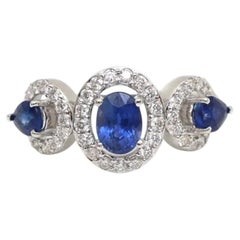 Anello in oro bianco 14 carati con zaffiro blu ovale da 2,49 carati e diamanti a halo