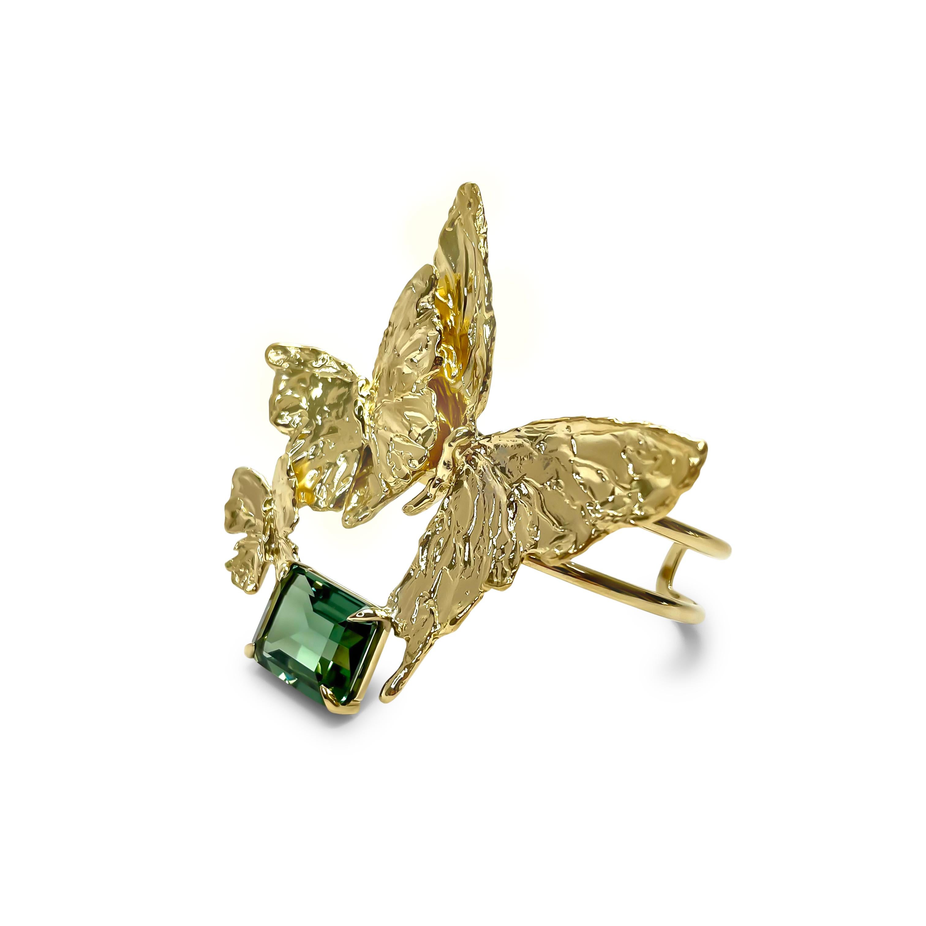 Intention: Sheer drama... the good kind!

Design: A trio of butterflies surround an emerald cut green quartz in this stunning cuff. Embodying the intention of our BELIEVE collection, this piece demands that you think big and bold(ly)!

Style