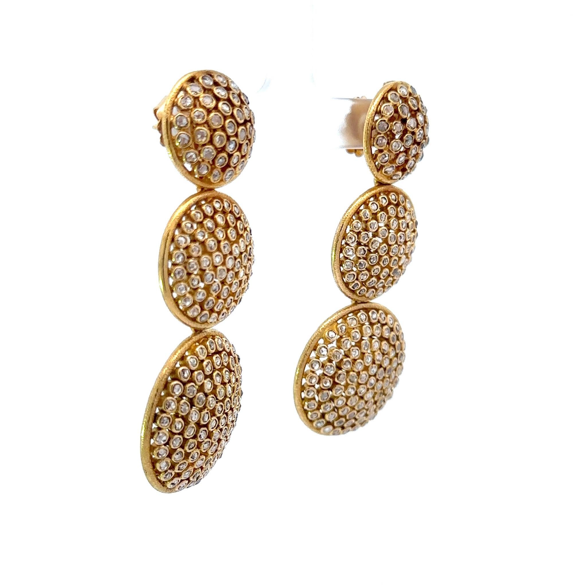 Fashionable, fun and elegant - that is what this magnificent pair of Diamond Drop earrings exude! The 18K Gold Triple Circle Drop Earrings hold a total of 4.50 carats, consisting of spectacular Rose Cut SI-VS diamonds, H/I color. The hand crafted