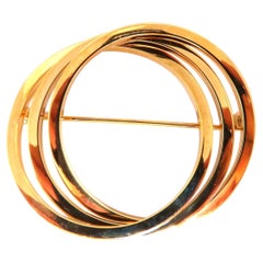 Spilla a triplo cerchio 18Kt