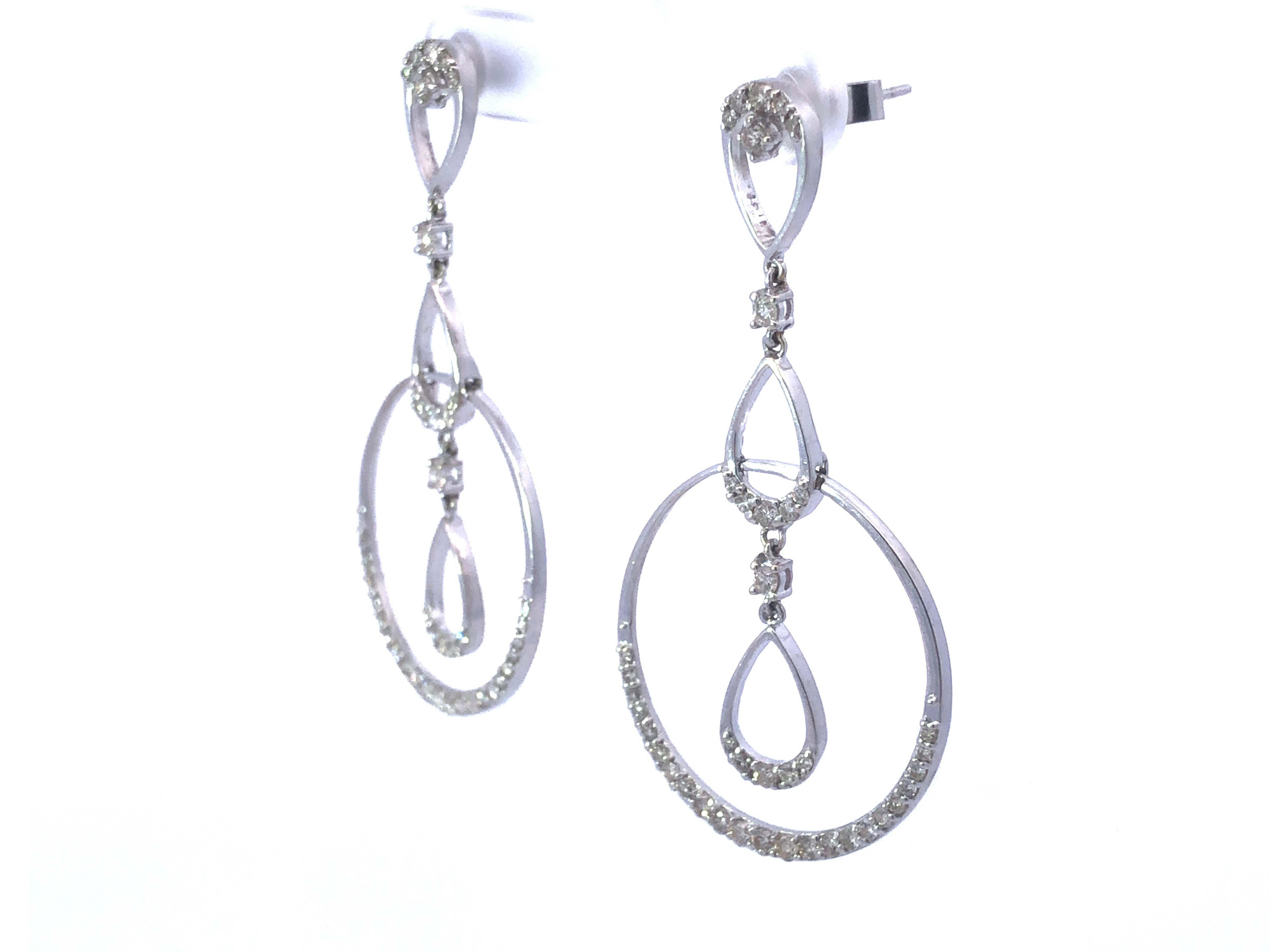 three diamond drop earrings