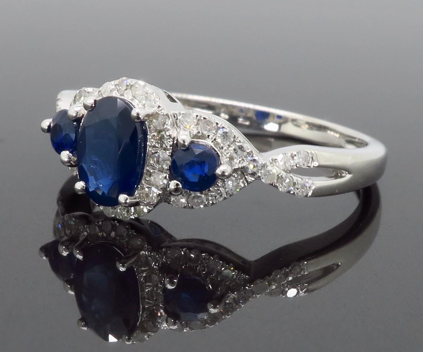 Oval Cut Triple Halo Diamond and Blue Sapphire Ring