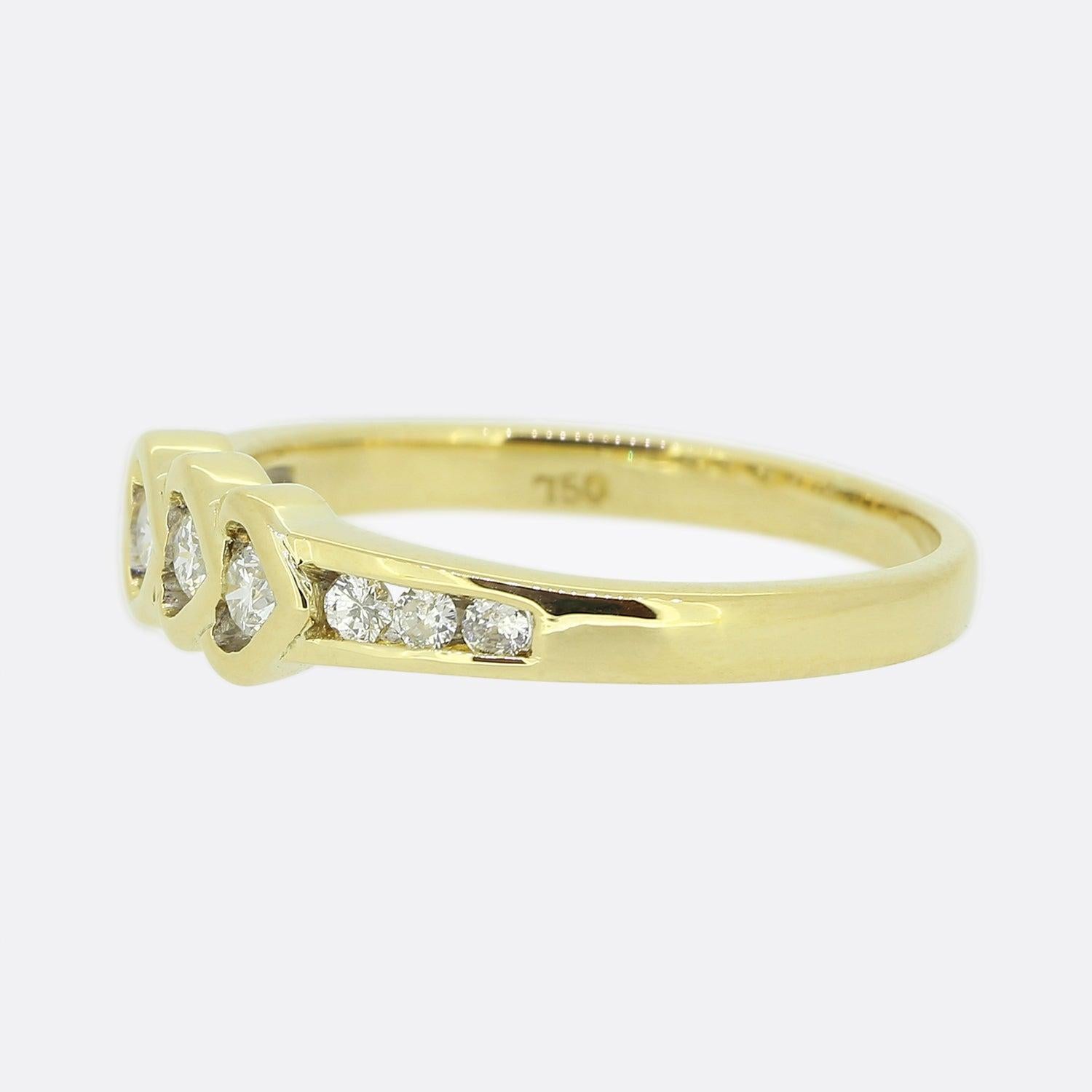 Here we have a wonderful diamond ring evoking feelings of love and affection. This piece has been crafted from 18ct yellow gold and showcases a trio of open heart motifs at the centre of the face; each of which has been individually set with a round