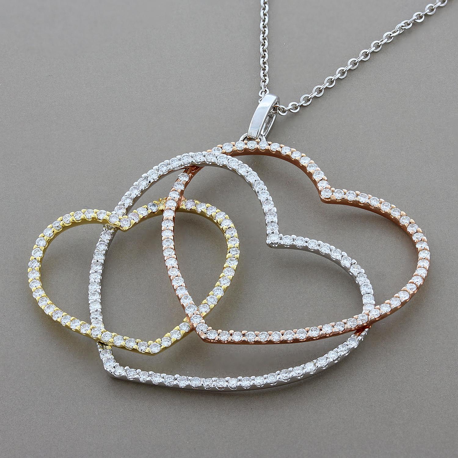 Love is in the air! This pendant of three intertwined tri-tone hearts features 2.07 carats of VS quality white diamonds. The rose gold, white gold and yellow gold heart halos are made of 18K gold. 

Chain Length: 18 inches
Pendant Length: 1 ¾