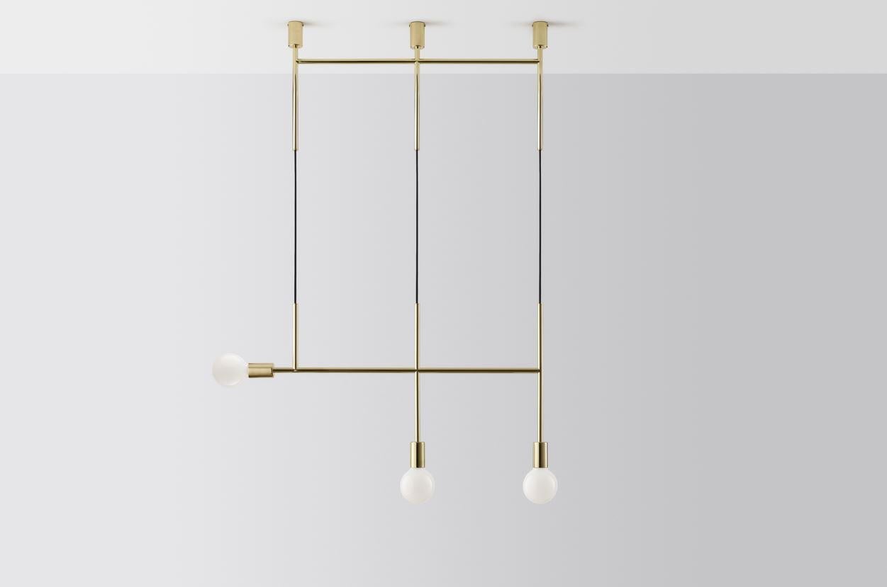 Triple kick by Volker Haug
Dimensions: W 98.7 x H min 108 cm
Materials: Polished, bronzed brass or steel
Finish: Raw, satin lacquer or powdercoat
Weight: approximately 3.5 kg

Lamp: 240V E27 (120V E26 US) 
Custom finishes available on