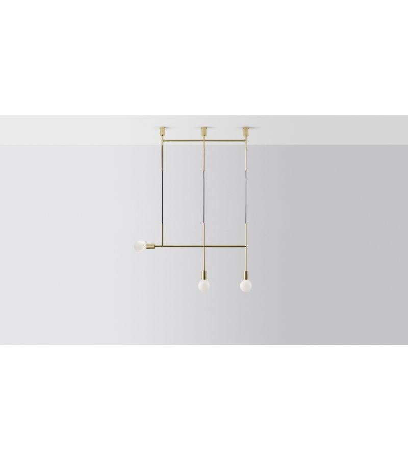 Triple kick pendant light by Volker Haug.
Dimensions: W 98.7 x H 108 cm. 
Material: Brass. 
Finishes: Polished, Aged, Brushed, Bronzed, Blackened, or Plated
Cord: Fabric or metal
Lamp: Opal G95 LED (E26/E27 110 - 240V, 12V version