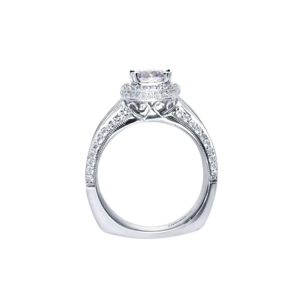 Ladies' Triple Pave 14k White Gold Diamond Engagement Mounting. Triple row of round and princess cut diamonds covers three different angles of the shank in classy channels. Center stone NOT included (ring takes 1.5-2.00 carat round stone) Side