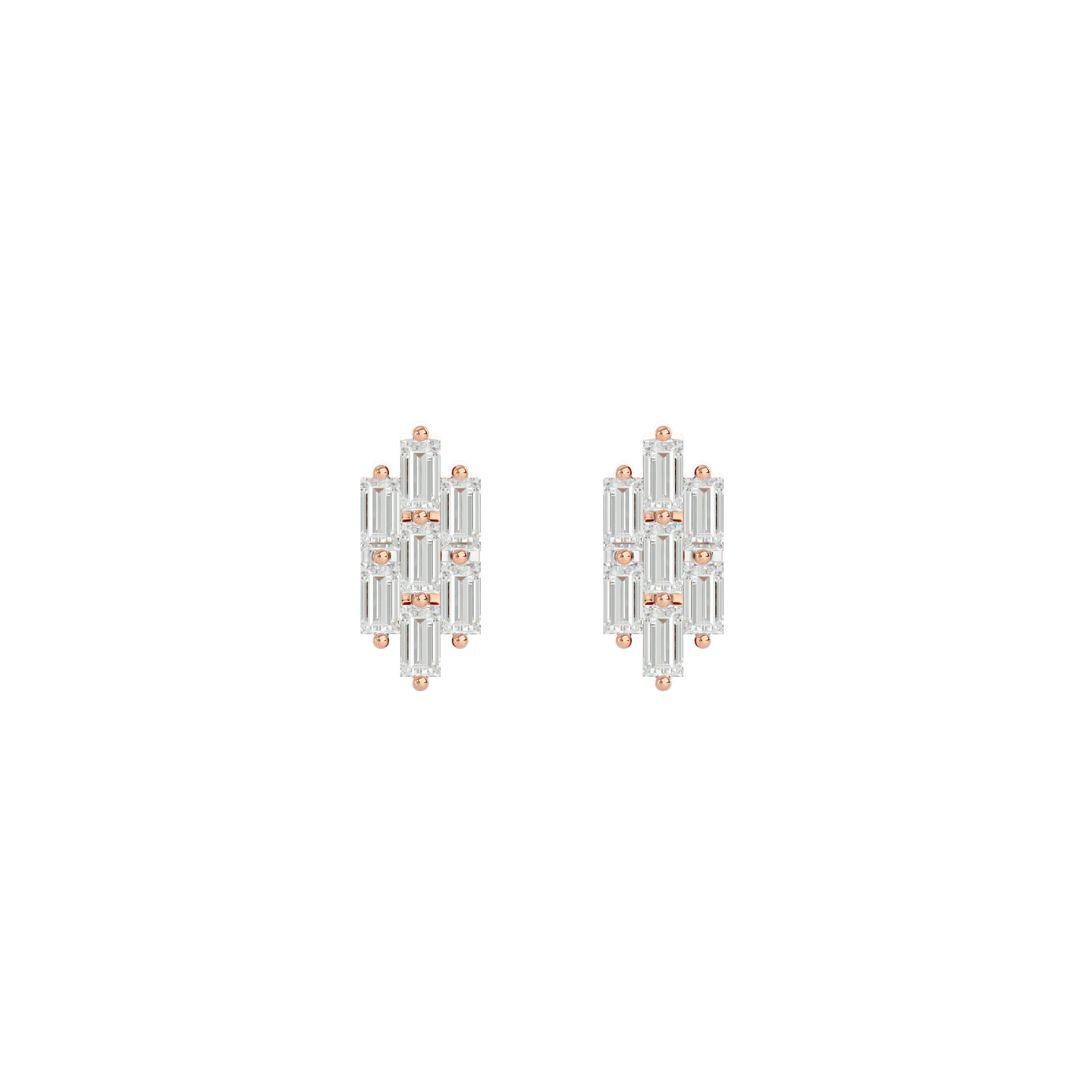Elements
These stunning and unique triple line earrings made with baguette diamonds, set in gold, will add a touch of luxury to any outfit.

Innovation
Our Triple Line Baguette Diamond Earrings are a modern take on traditional geometric forms. The
