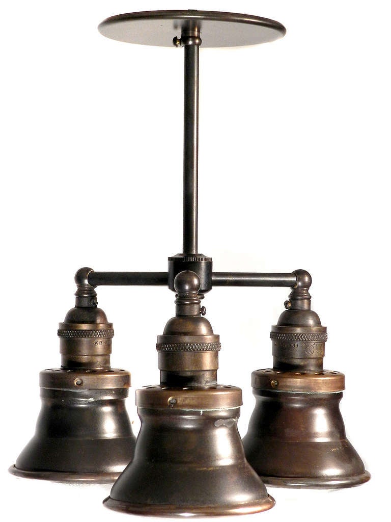 The small size of this chandelier makes it very versatile. It's a surprising change from the common one light pendant. The diameter is only ten inches. The total height of the pictured lamp is 12 inches tall but it can easily change for longer drop
