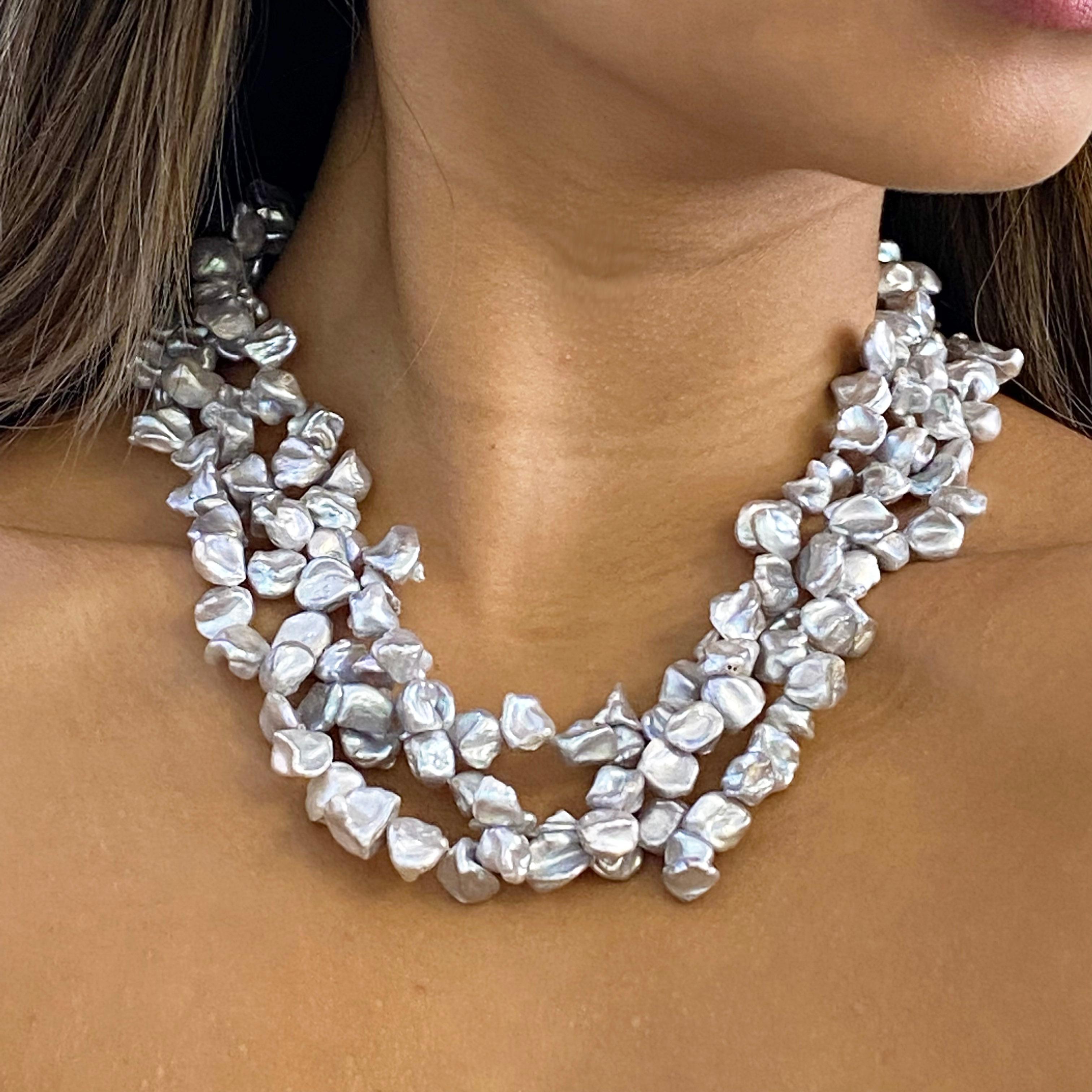 These baroque pearls are so interesting and unique. Each pearl has formed its own unique shape created by Mother Nature! The gray color has lots of luster and pairs perfectly with black, red, pink, blue colors. This is definitely a statement