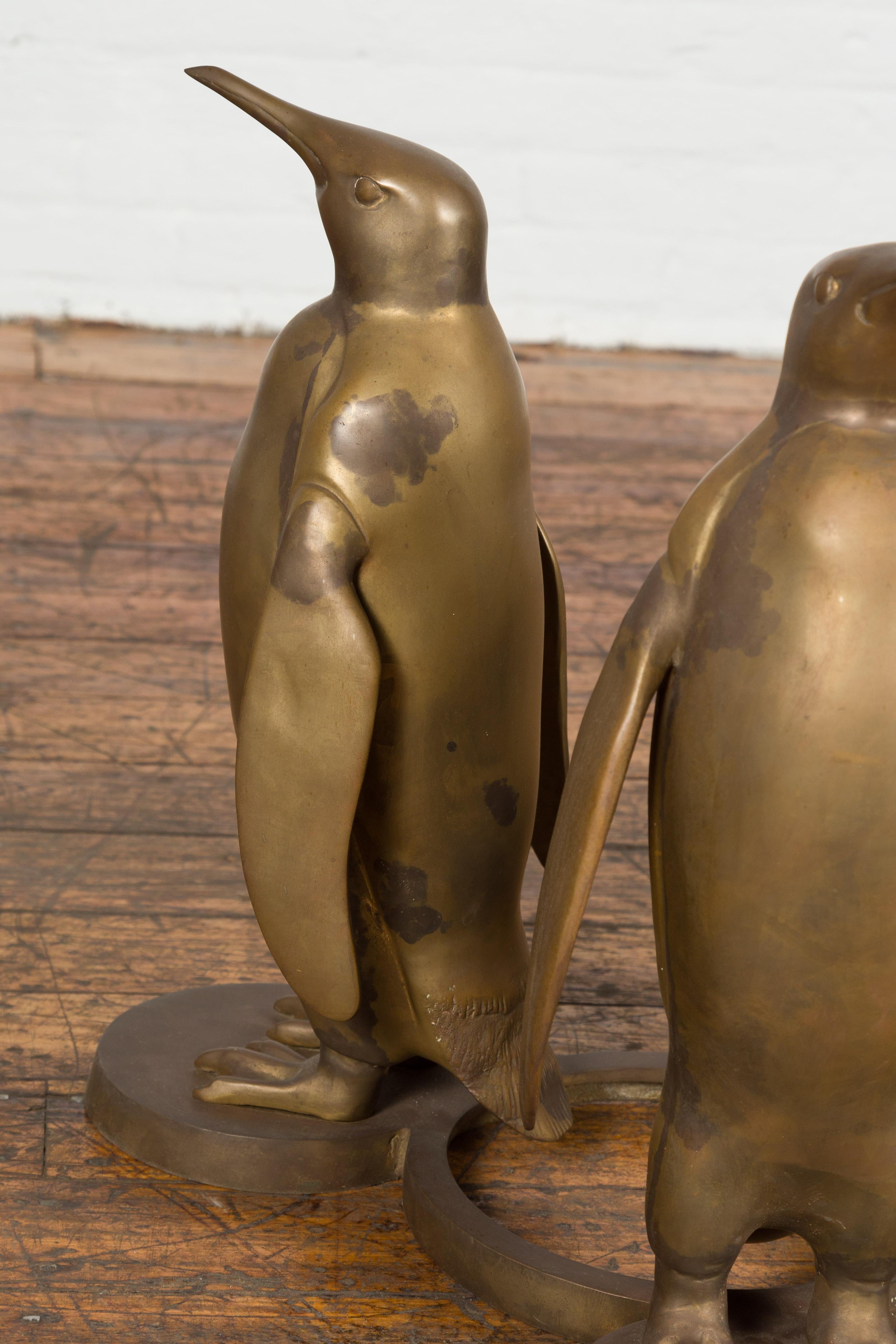 Triple Penguin Bronze Sculpted Group on Trefoiled Base with Gold Patina In Good Condition For Sale In Yonkers, NY