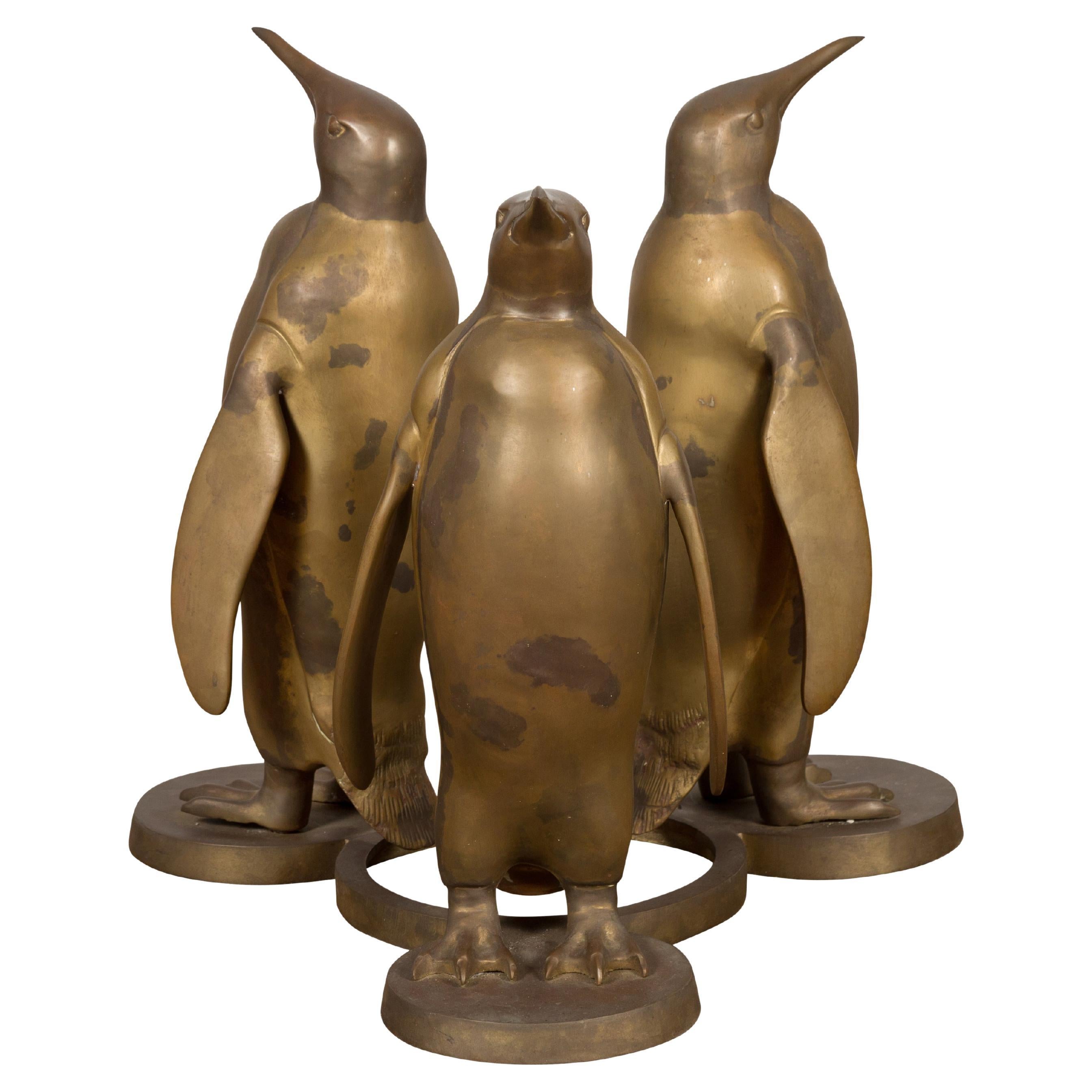 Triple Penguin Bronze Sculpted Group on Trefoiled Base with Gold Patina For Sale
