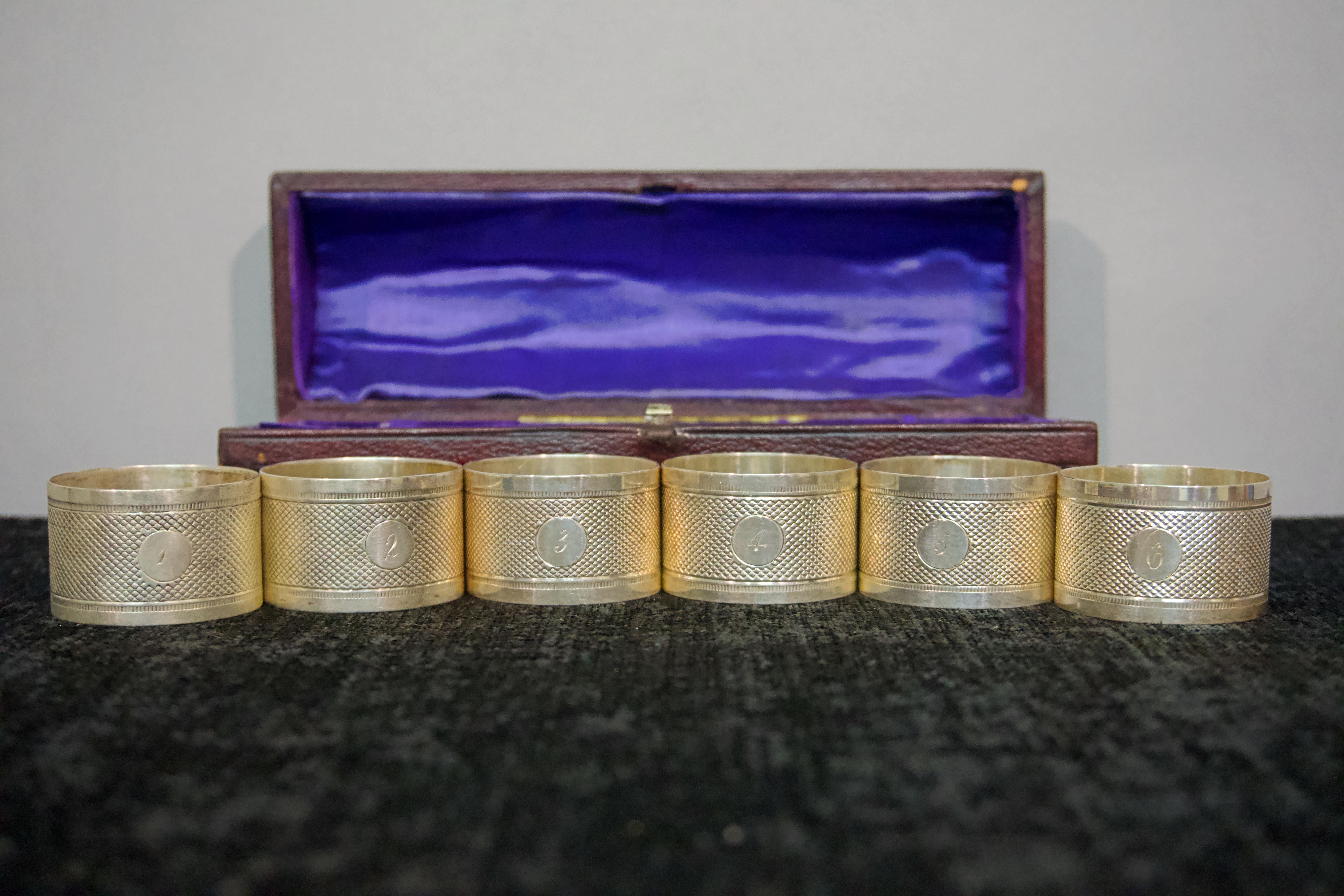 Triple-plated silver engravable napkin rings with presentation case. Barnby & Rust makers label.