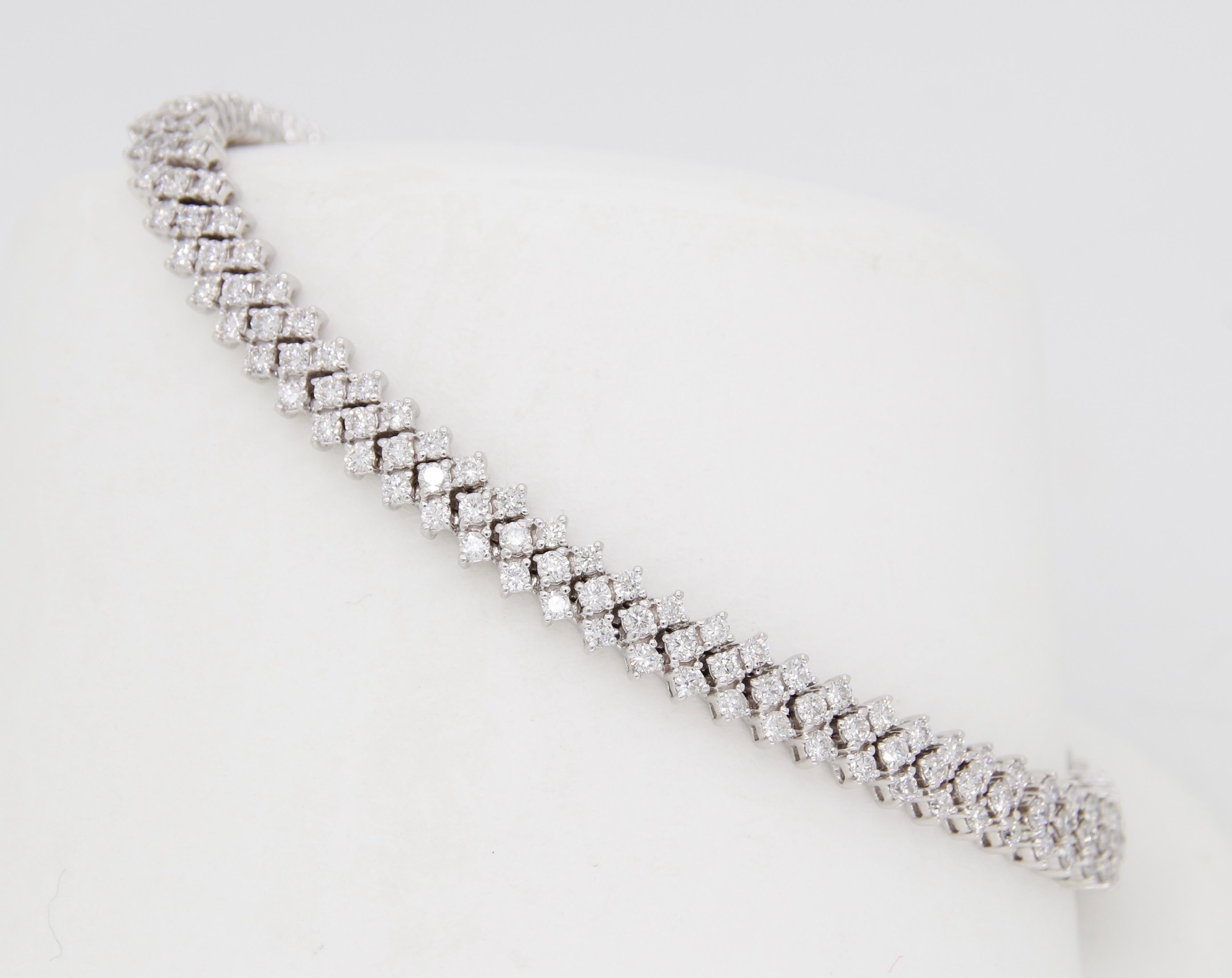 Approximately 3.42CTW triple row diamond tennis bracelet crafted in white gold. 

Diamond Carat Weight: Approximately 3.42CTW
Diamond Cut: Round Brilliant Cut 
Color: Average: H-I
Clarity: Average: SI
Metal: 10K White Gold
Marked/Tested: Stamped