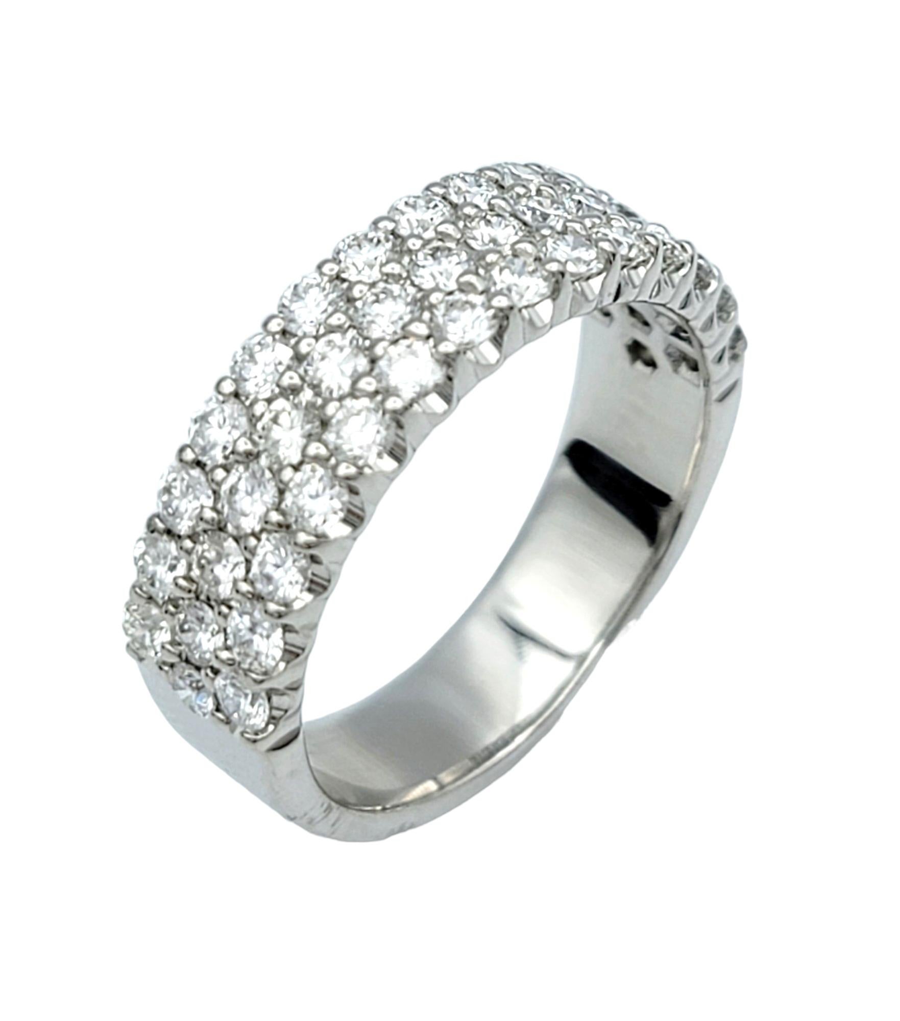Ring size: 7.25

Elegance meets sophistication in this stunning three-row diamond band ring, meticulously crafted in lustrous 18 karat white gold. Designed to captivate and endure, this exquisite piece exudes timeless charm and luxurious