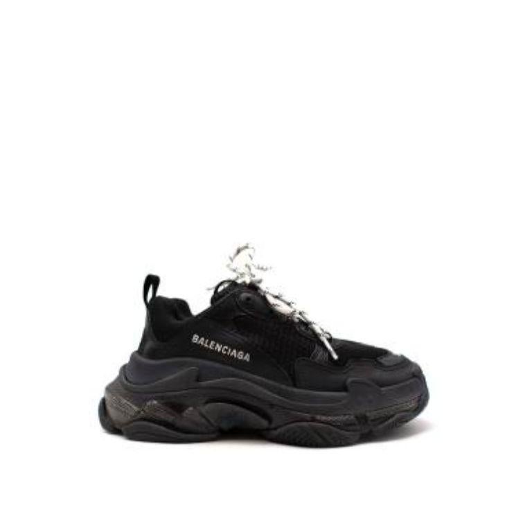 Balenciaga Triple S Leather And Mesh Mid-top Sneakers
 

 - Three layered running style sole 
 - Mesh body with leather panel details
 - Logo embroidery 
 - White and black lace fastening
 - Pull loop detail 
 

 Materials:
 Upper: Leather and mesh
