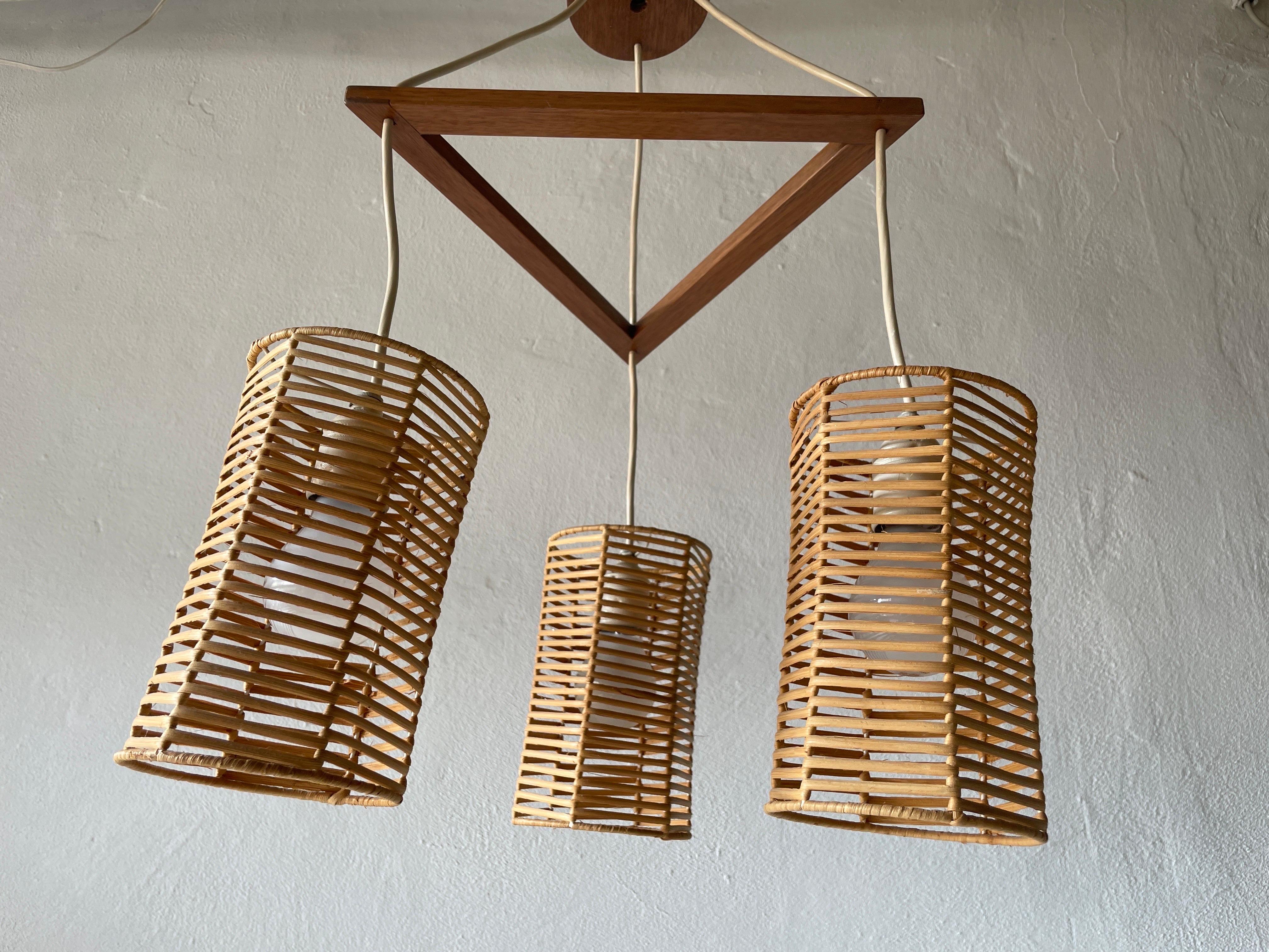 Triple Shade Wicker and Wood Pendant Lamp, 1960s, Germany

Lampshade is in very good vintage condition.
No crack, no missed piece.
Original canopy.

This lamp works with 3x E27 light bulb. Max 100W
Wired and suitable to use with 220V and 110V for