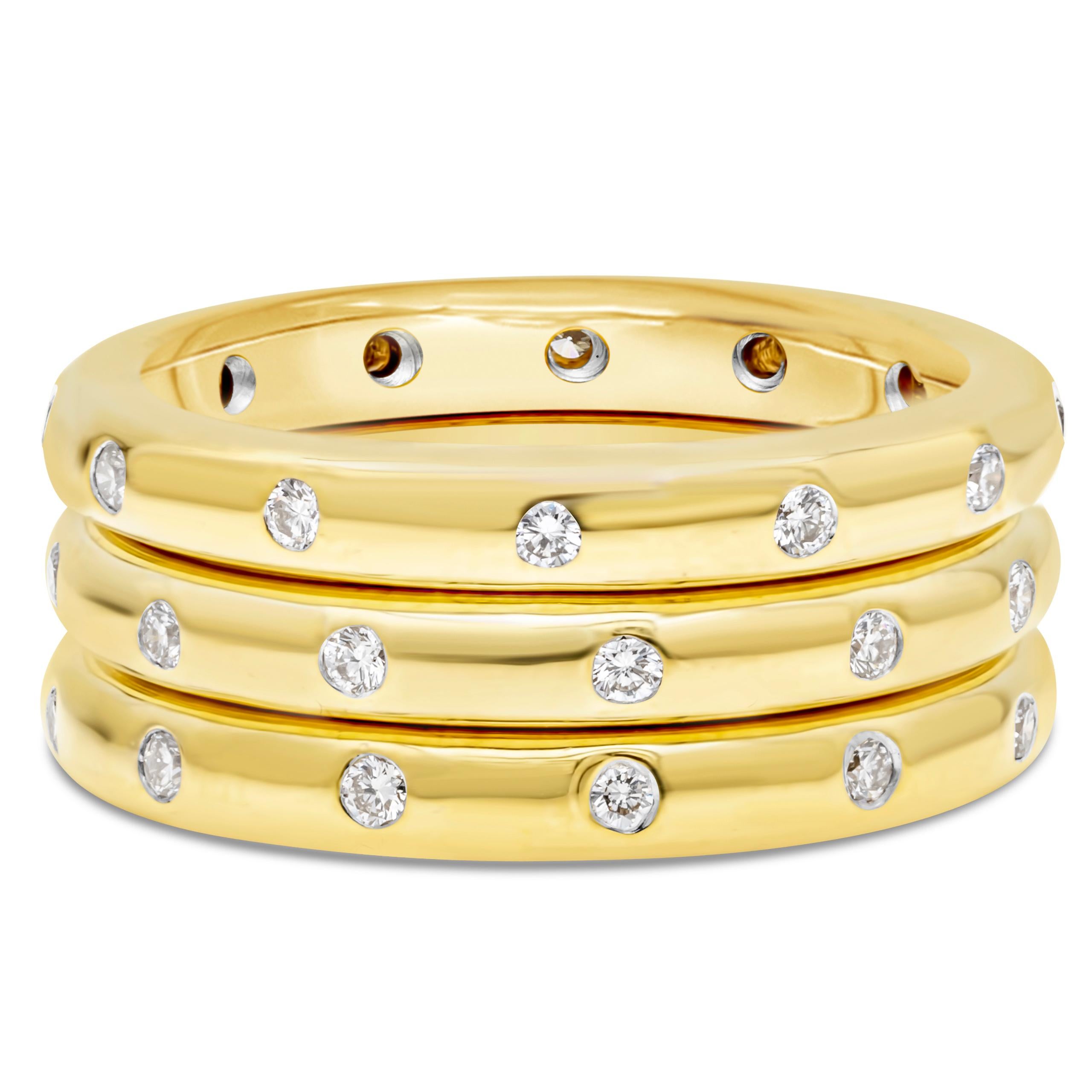 A fashionable three stackable rings showcasing 0.58 carats total of round brilliant diamonds, flush-set and spaced evenly in a rounded 18K Yellow Gold mounting. F color and VS in clarity, size 6.5 US. Perfect for everyday use. 

Roman Malakov is a