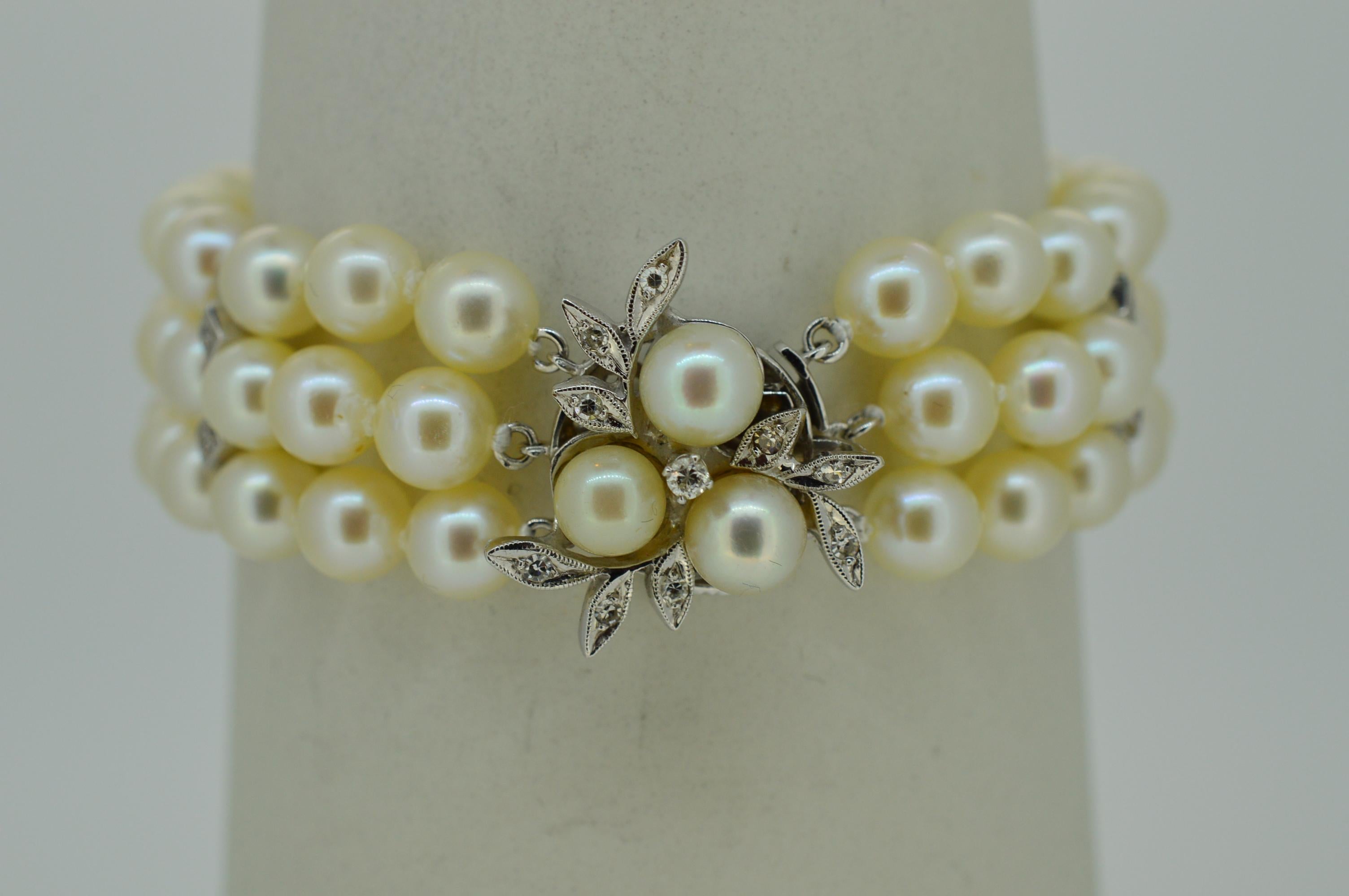Triple Strand Akoya Pearl Bracelet w White Gold Diamond Floral Charm Clasp In Excellent Condition In Mount Kisco, NY