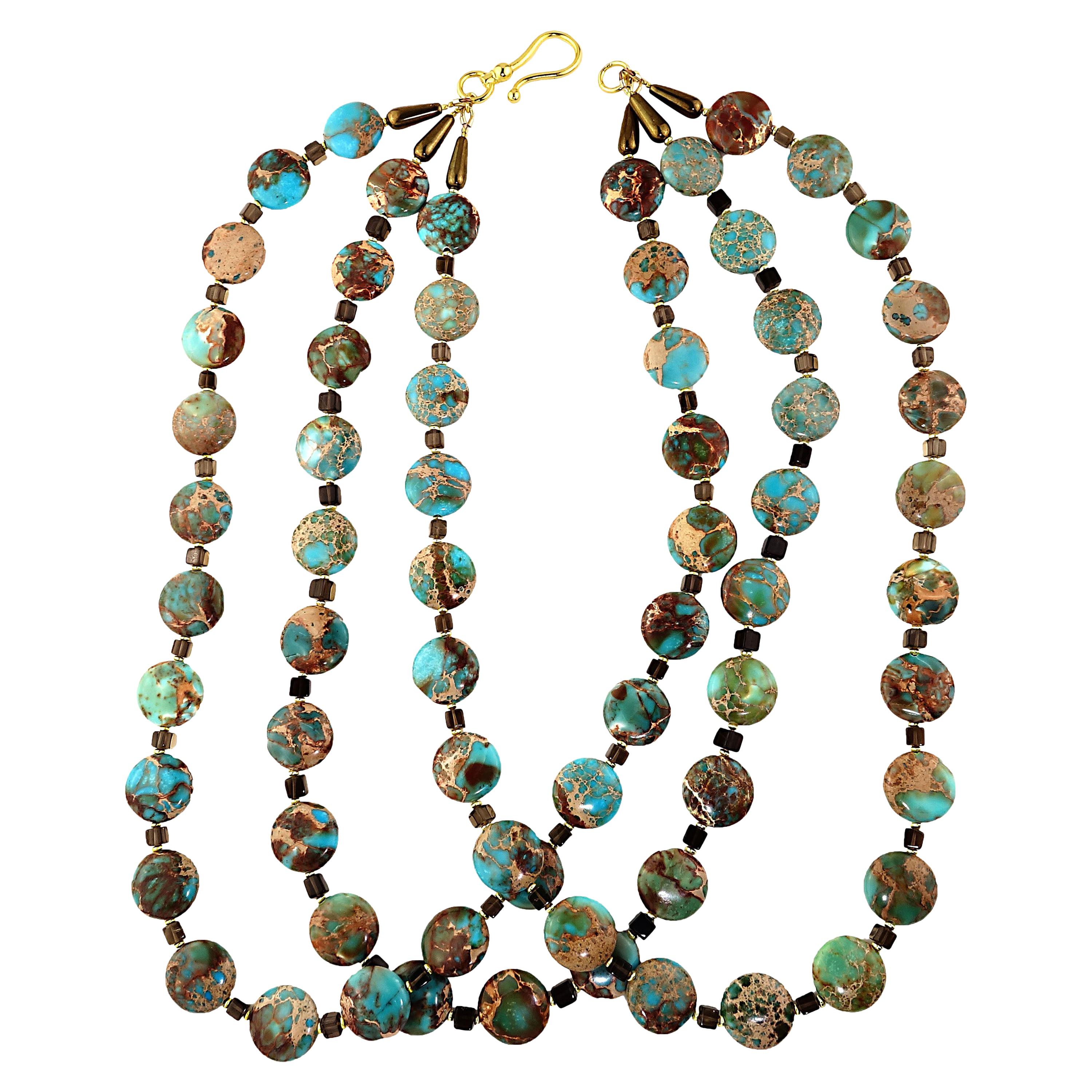 Unique necklace of three strand Desert Jasper and Smoky Quartz.  This one of a kind necklace features three stands 24-25 inches in length.  They are that fabulous mottled combination of turquoisey blue and brownish gold that is beautifully displayed