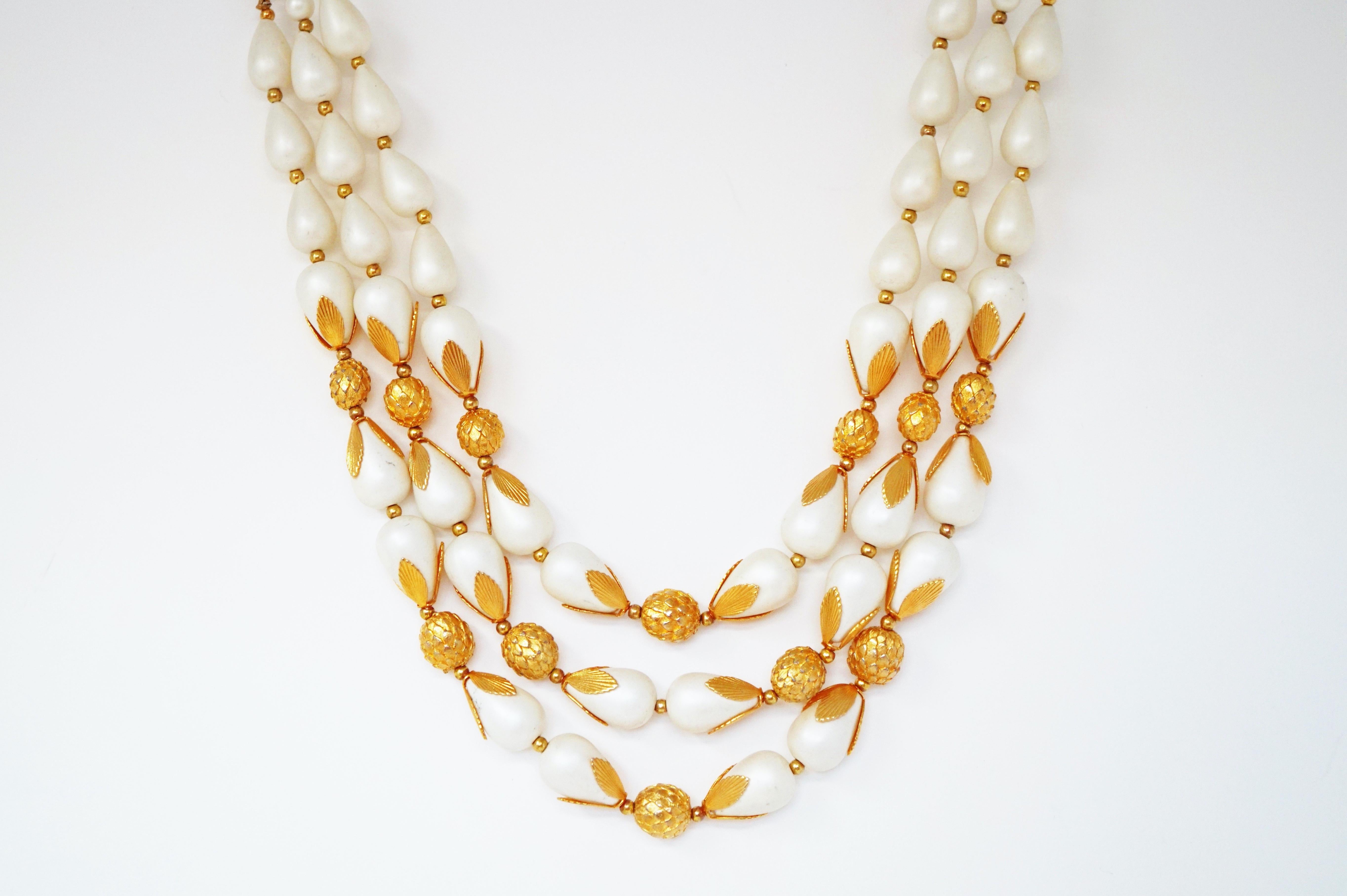 This gorgeous vintage triple strand statement necklace by Deauville, circa 1950, is an elegant piece of costume jewelry history.  Perfect for dressing up an evening look, this piece is a wonderful addition to an upscale jewelry