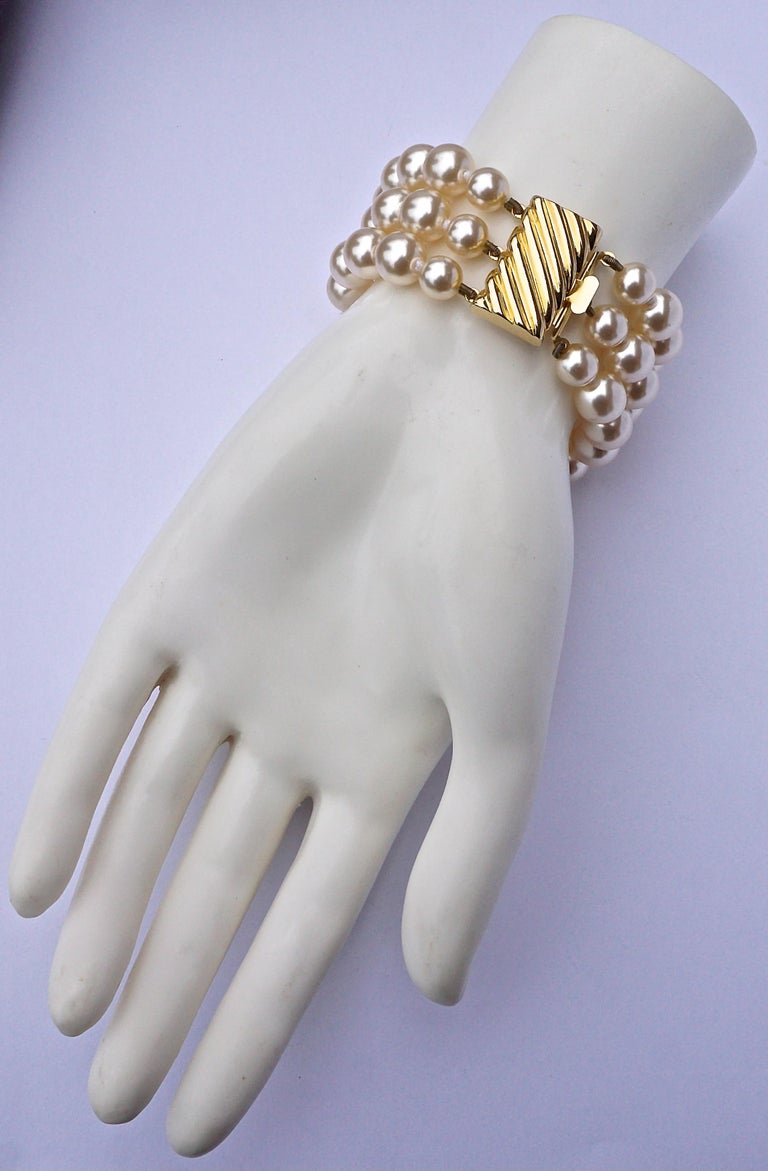 Triple Strand Knotted Faux Pearl Bracelet with a Fancy Gold Tone Clasp
