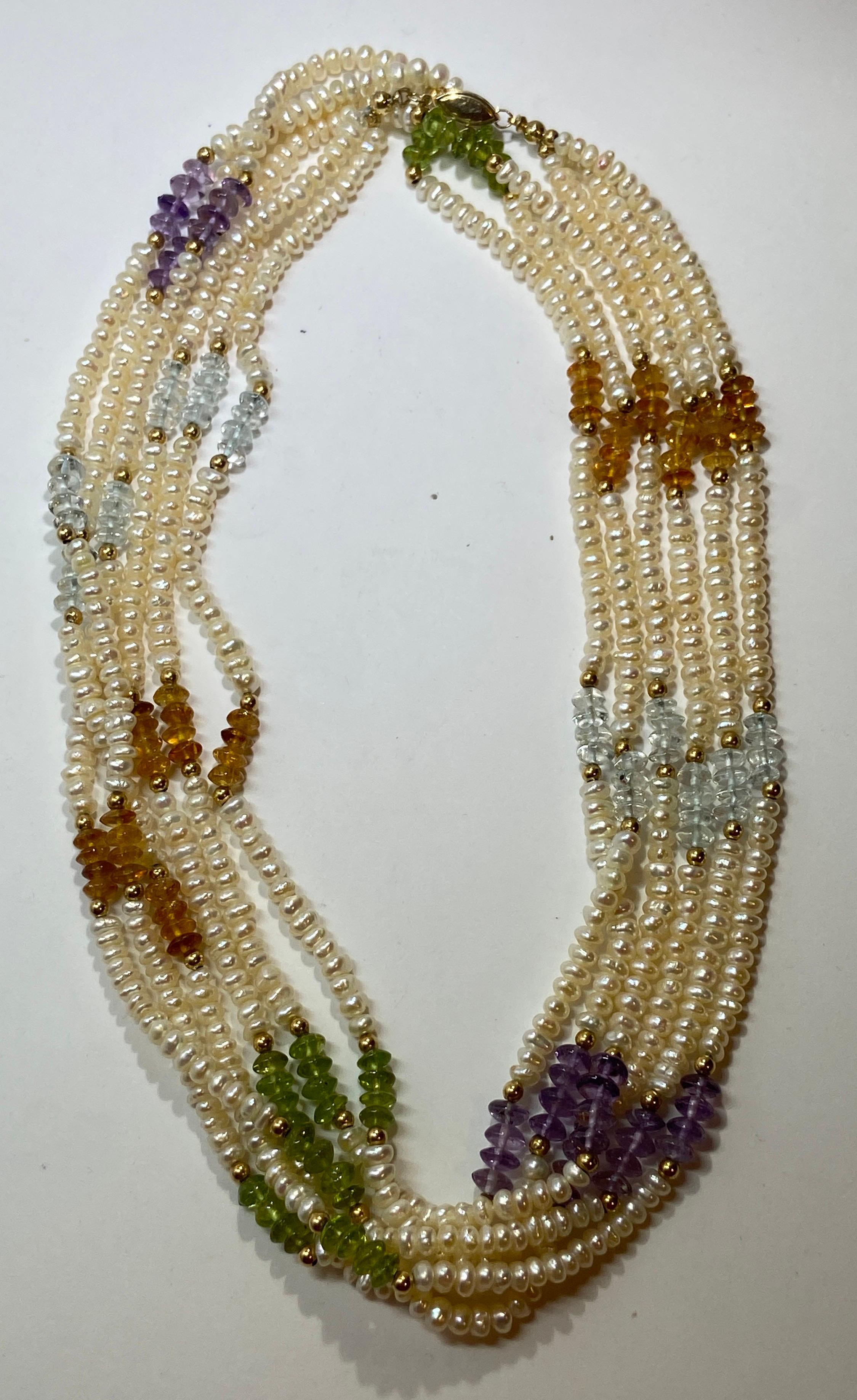 Wonderfully elegant triple-strand freshwater pearls accented with semi-precious stones and highlighted with micro gold hardware necklace measures 34 inches in total. The clasp is of gold hardware. Made in US.
