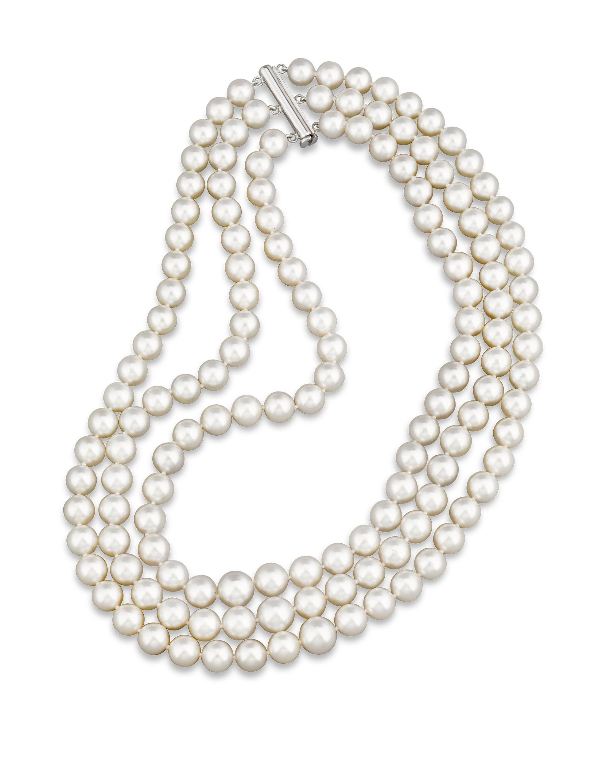 Three strands of graduated white South Sea pearls comprise this classic necklace. The perfectly matched gems range in size from 10.5mm to 8mm and are secured with a 14K white gold clasp. Hailing from the warm waters of the South Pacific, South Sea
