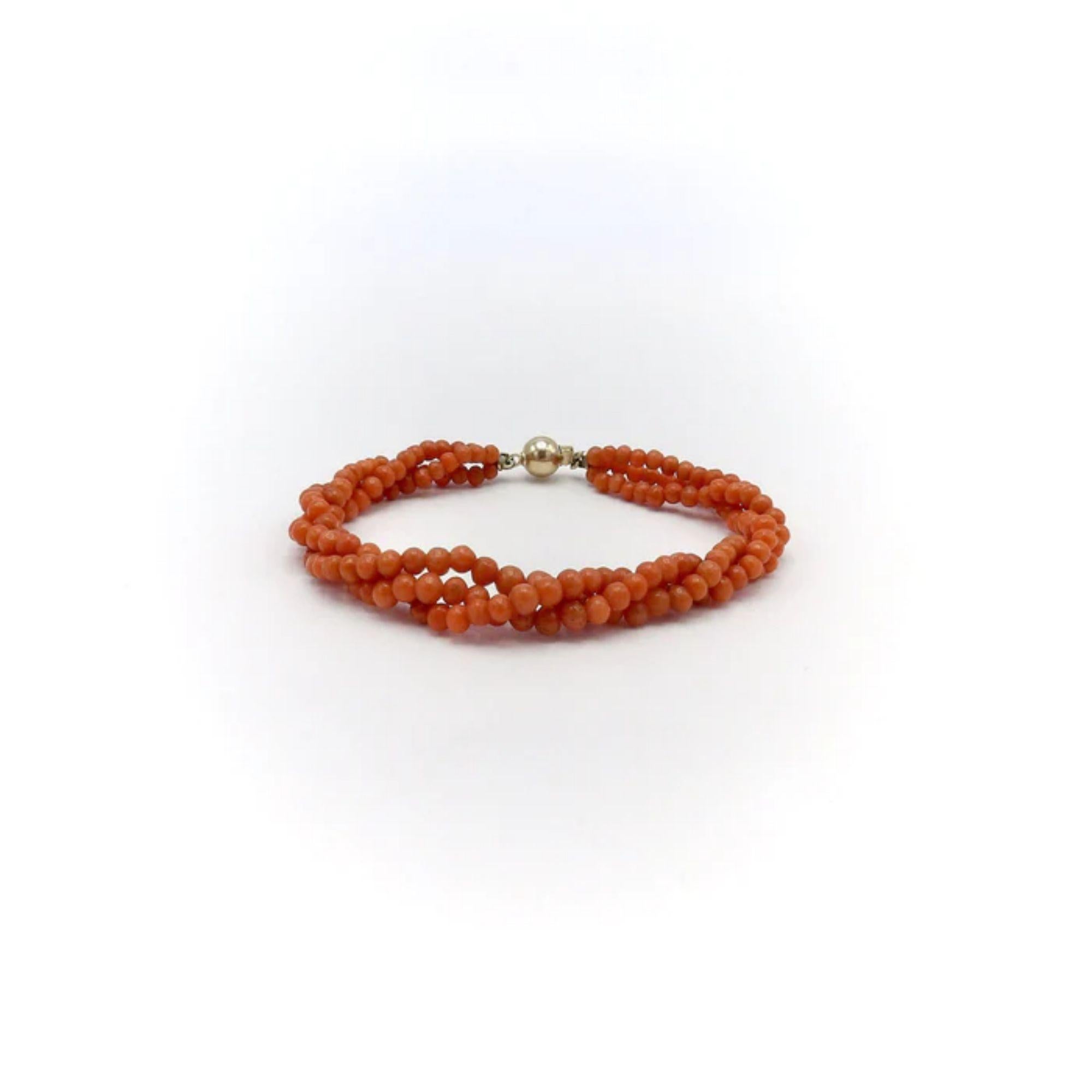 Triple Strand Victorian Salmon Coral Bracelet with 14K Gold Clasp, circa 1900
 
A Victorian-era coral bracelet with three strands of salmon-colored beads and a 14k gold ball clasp. The imperfectly shaped beads differ in roundness and color, with the