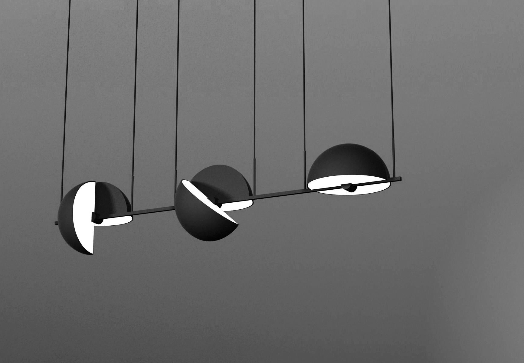 Triple trapeze pendant by Jette Scheib
Dimensions: 37.5 x 152 x 28 cm (Ø) (cord length: 300 cm)
A chrome version is also available.

Trapeze is as much a single pendant as it is an endless system of possibilities. The square tube has a build in