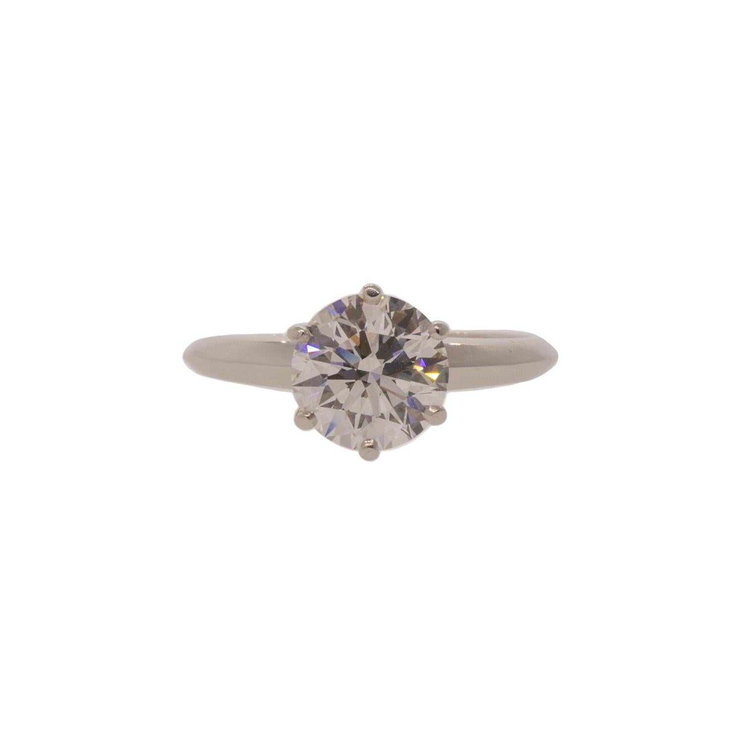 A truly timeless classic. This estate piece exemplifies the craftsmanship of Tiffany & Co. The centerpiece is a Triple-X round brilliant cut 1.64ct diamond with G/VVS1 color and clarity. A Triple-X refers to a diamond that has an excellent cut,