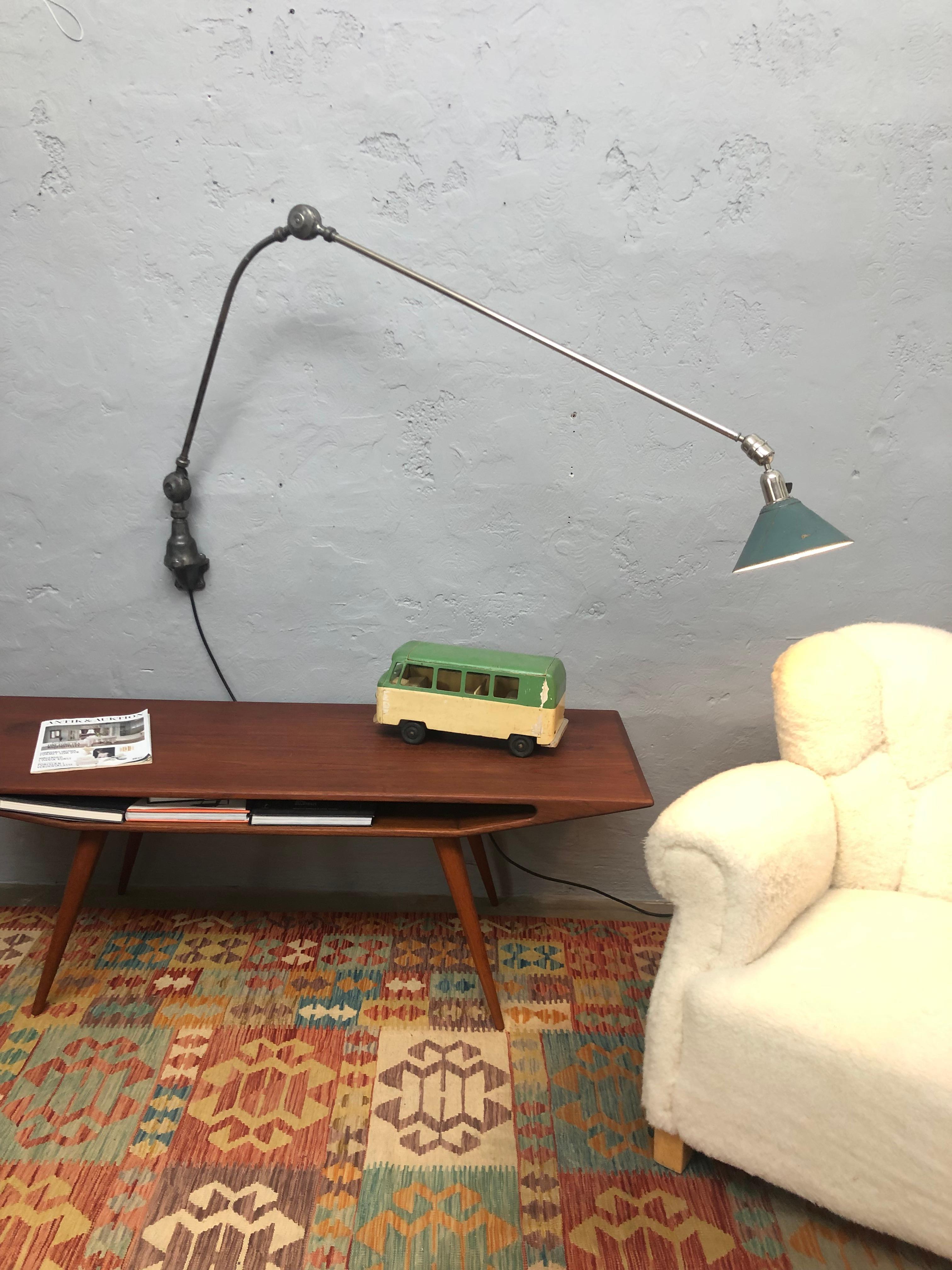An iconic Triplex wall lamp from the 1930s in original condition. 
Still with its original green cardboard shade. 
ASEA of Sweden created some of the most iconic lamps of the period.
Designed by Johan Petter Johansson 1853-1943 who was responsible