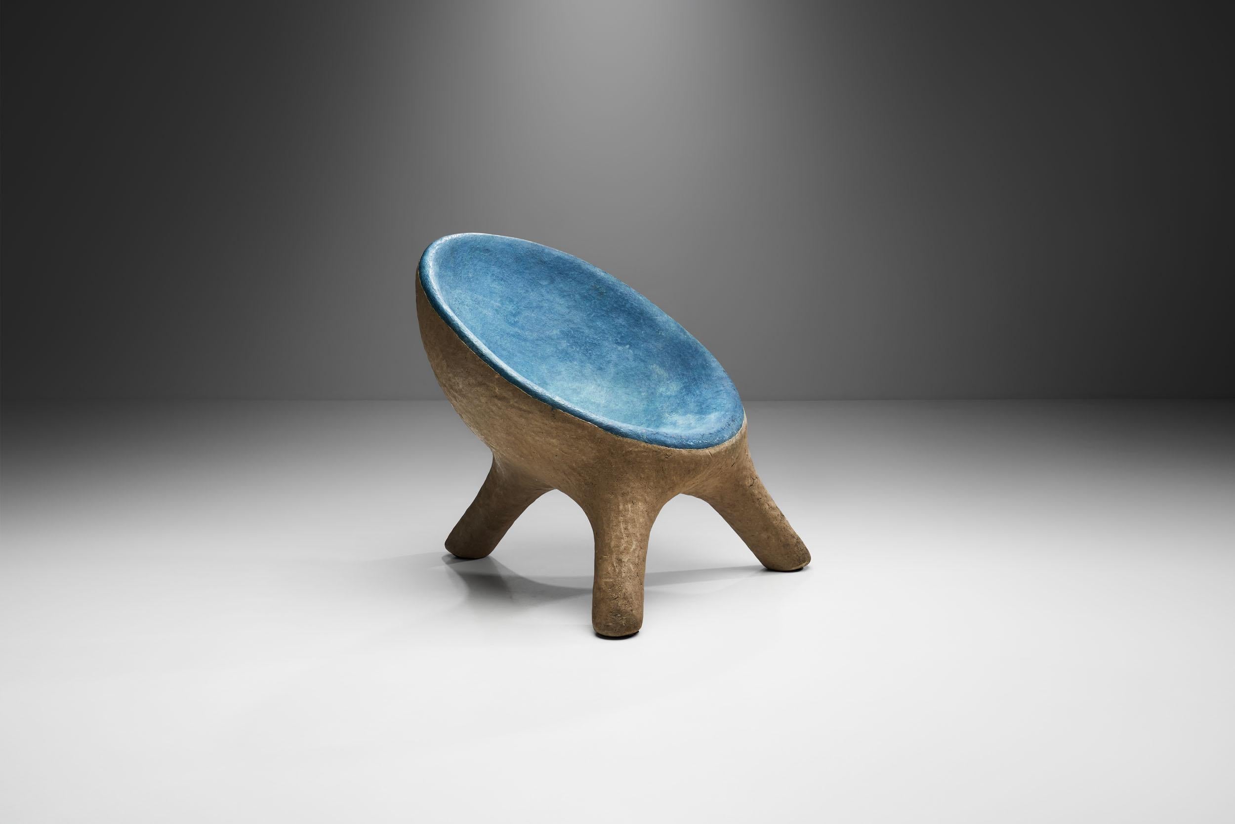 This artisanal tripod chair is unique both visually and with regard to its material. Resin furniture of the 1970s are quite rare as most were made by hand, as mass production is almost impossible because of the qualities of the material.

Resin is