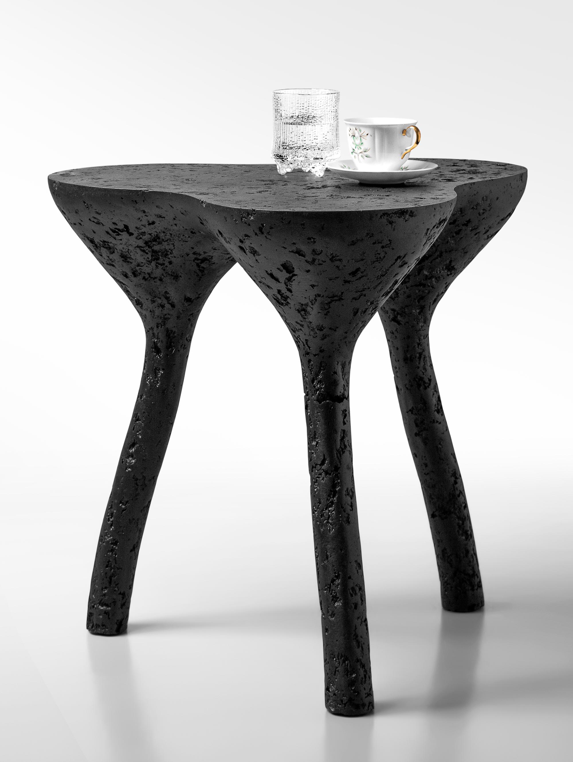 Tripod Coffee Table by Kasanai
Dimensions: D 50 x H 52 cm.
Materials: Concrete, wood, recycled paper, glue, paint
6 kg.

The fusion of sturdiness and elegance, along with the blend of archaism and modernity. More than just a surface for placing