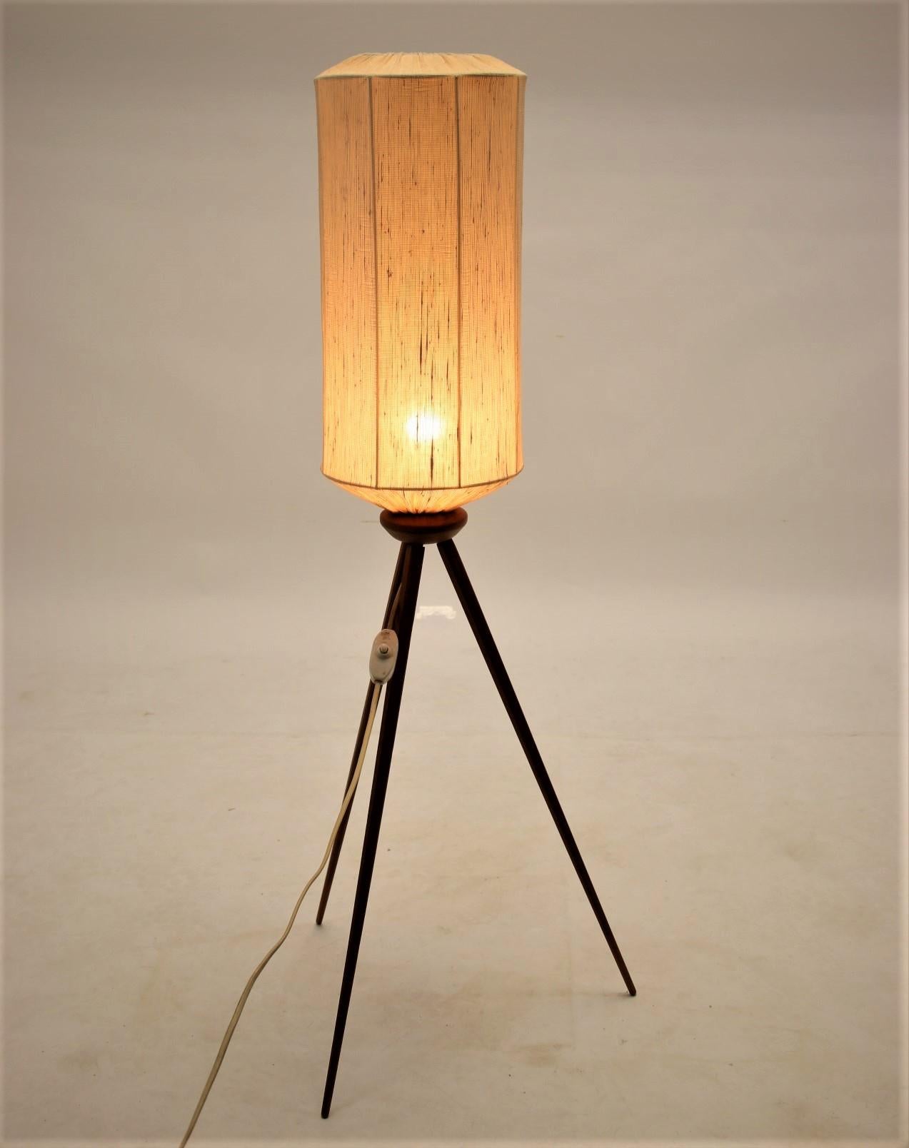 Special yet iconic for the 1950's and 1960's floor lamp.

Brought from Sweden, with its minimalist, trendy look it fits in almost any interior.

The lamp has a base on which it stands with 3 teak legs.

The shade consists of textile with a